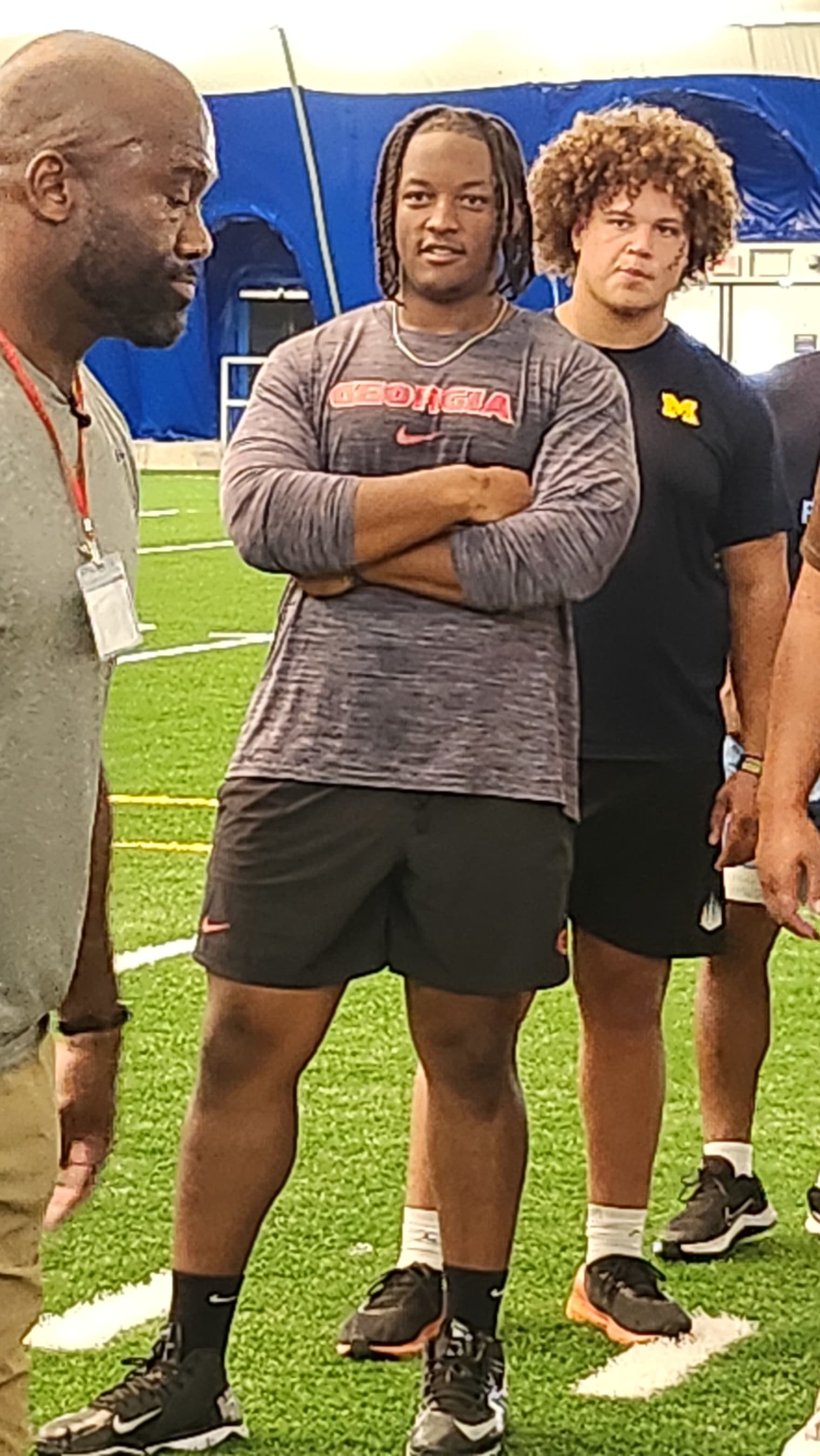 Georgia's Jared Wilson looks on as LeCharles Bently directs a drill. 