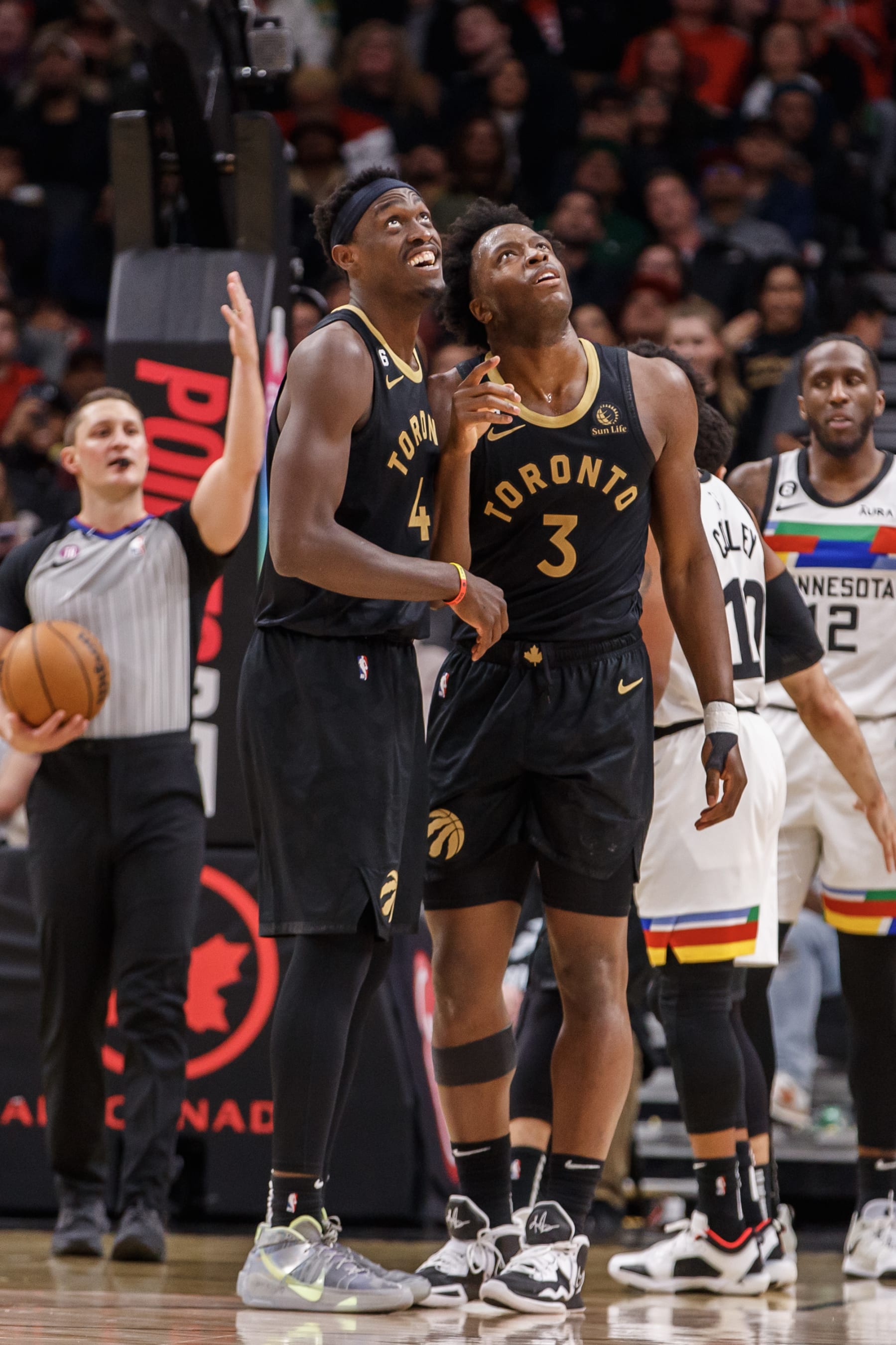 TORONTO, ON - MARCH 18: Pascal Siakam #43 and O.G. Anunoby #3 of the Toronto Raptors watch a replay of Anuoby's dunk on the big screen during the first half of their NBA game against the Minnesota Timberwolves at Scotiabank Arena on March 18, 2023 in Toronto, Canada. NOTE TO USER: User expressly acknowledges and agrees that, by downloading and or using this photograph, User is consenting to the terms and conditions of the Getty Images License Agreement. (Photo by Cole Burston/Getty Images)