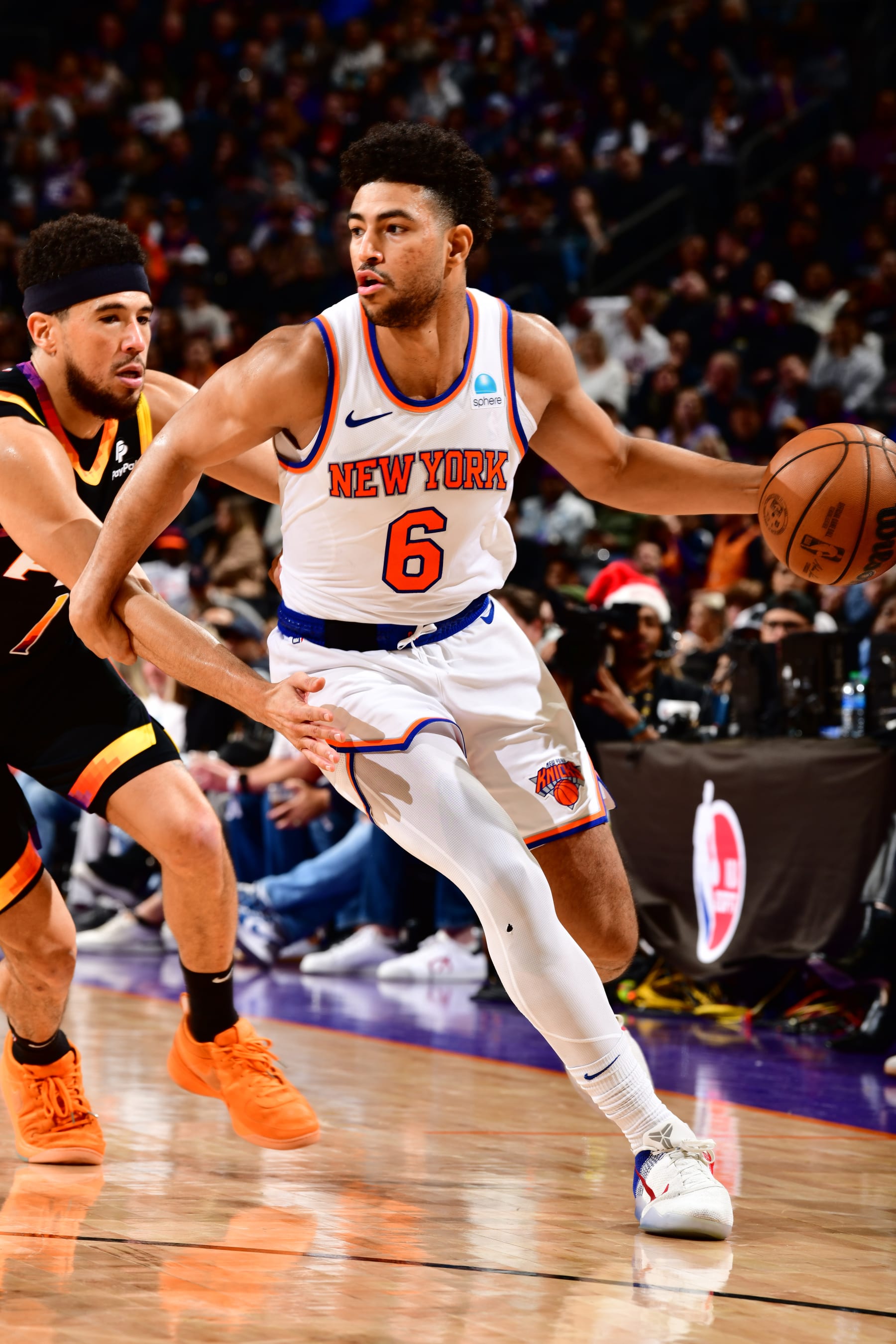 PHOENIX, AZ - DECEMBER 15:  Quentin Grimes #6 of the New York Knicks handles the ball during the game against the Phoenix Suns on December 15, 2023 at Footprint Center in Phoenix, Arizona. NOTE TO USER: User expressly acknowledges and agrees that, by downloading and or using this photograph, user is consenting to the terms and conditions of the Getty Images License Agreement. Mandatory Copyright Notice: Copyright 2023 NBAE (Photo by Barry Gossage/NBAE via Getty Images)