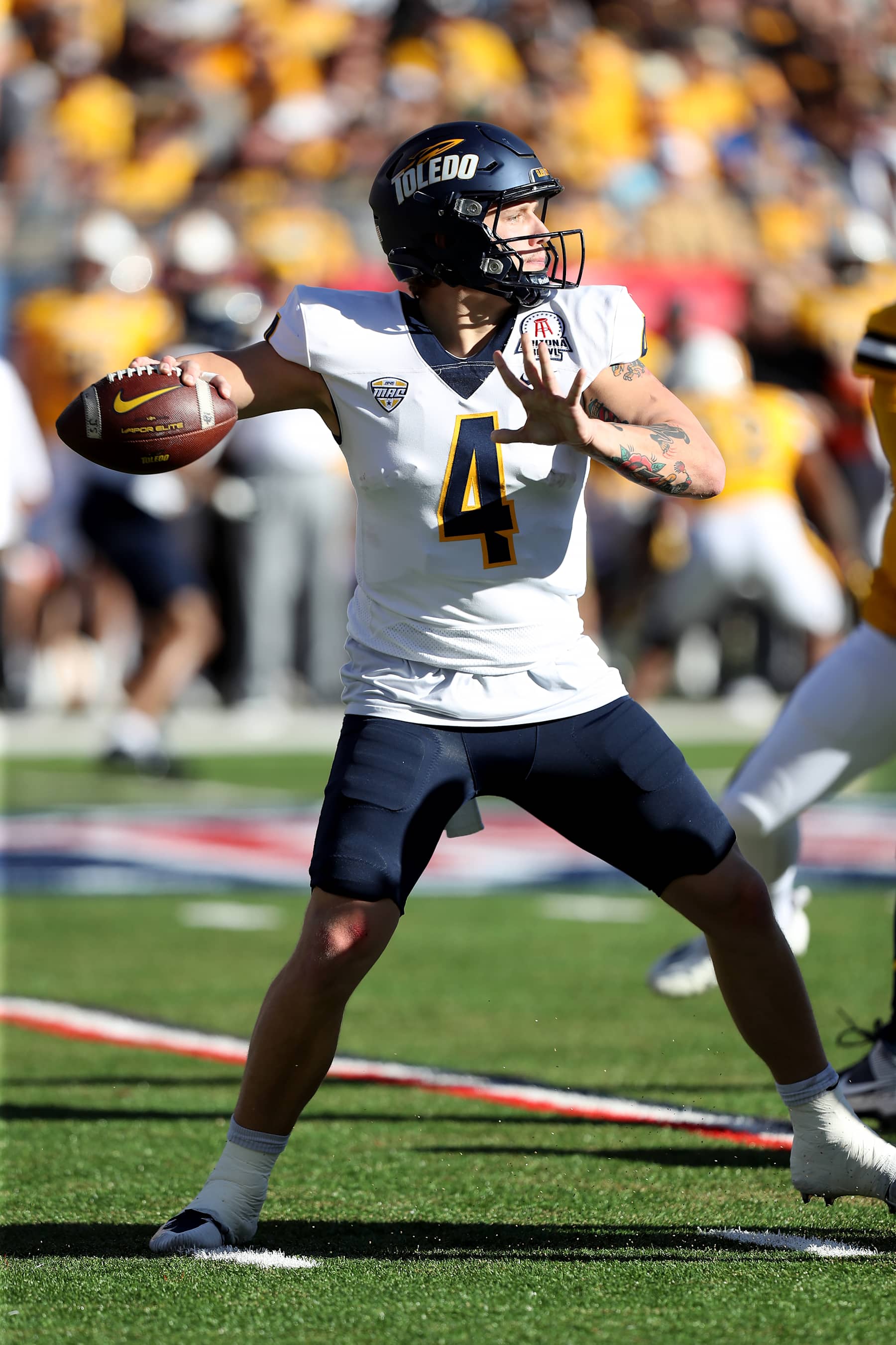 TUCSON, AZ - DECEMBER 30: Toledo Rockets quarterback Tucker Gleason #4 during the Barstool Sports Arizona Bowl between the Toledo Rockets and the Wyoming Cowboys on December 30, 2023 at Arizona Stadium in Tucson, AZ. (Photo by Christopher Hook/Icon Sportswire via Getty Images)