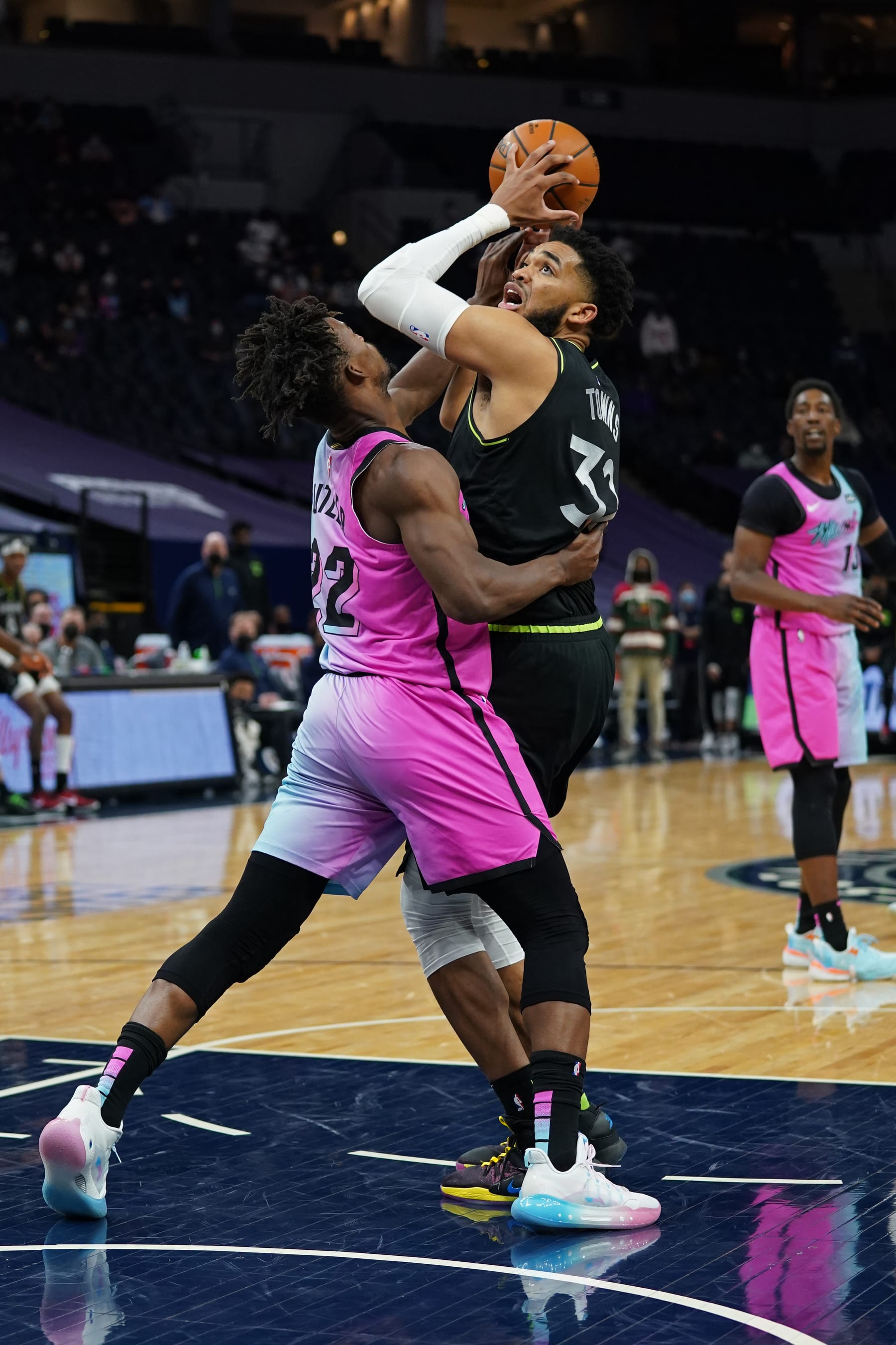 MINNEAPOLIS, MN -  APRIL 16: Jimmy Butler #22 of the Miami Heat plays defense against Karl-Anthony Towns #32 of the Minnesota Timberwolves on April 16, 2021 at Target Center in Minneapolis, Minnesota. NOTE TO USER: User expressly acknowledges and agrees that, by downloading and or using this Photograph, user is consenting to the terms and conditions of the Getty Images License Agreement. Mandatory Copyright Notice: Copyright 2021 NBAE (Photo by Jordan Johnson/NBAE via Getty Images)