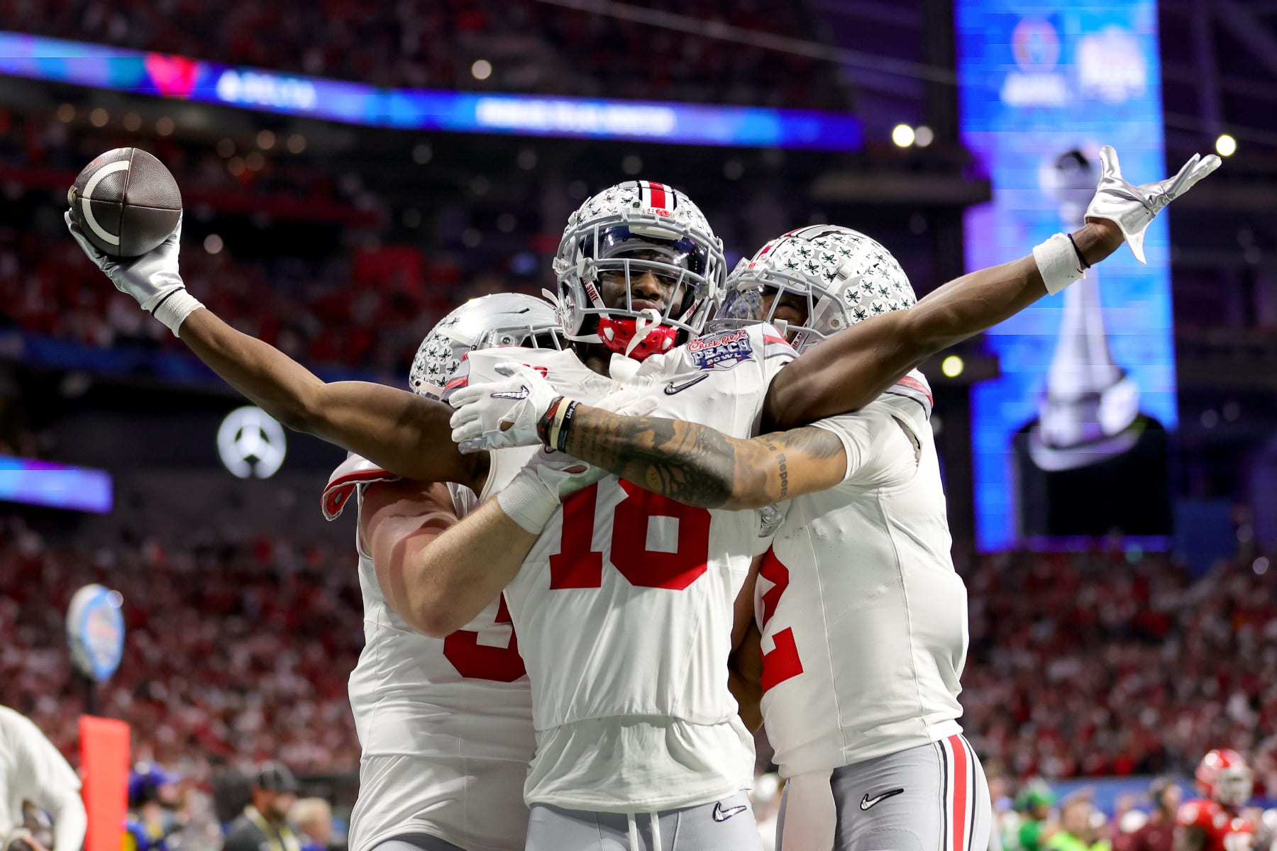 ATLANTA, GEORGIA - DECEMBER 31: Marvin Harrison Jr. #18 of the Ohio State Buckeyes celebrates after a touchdown during the second quarter in the Chick-fil-A Peach Bowl at Mercedes-Benz Stadium on December 31, 2022 in Atlanta, Georgia. (Photo by Carmen Mandato/Getty Images)