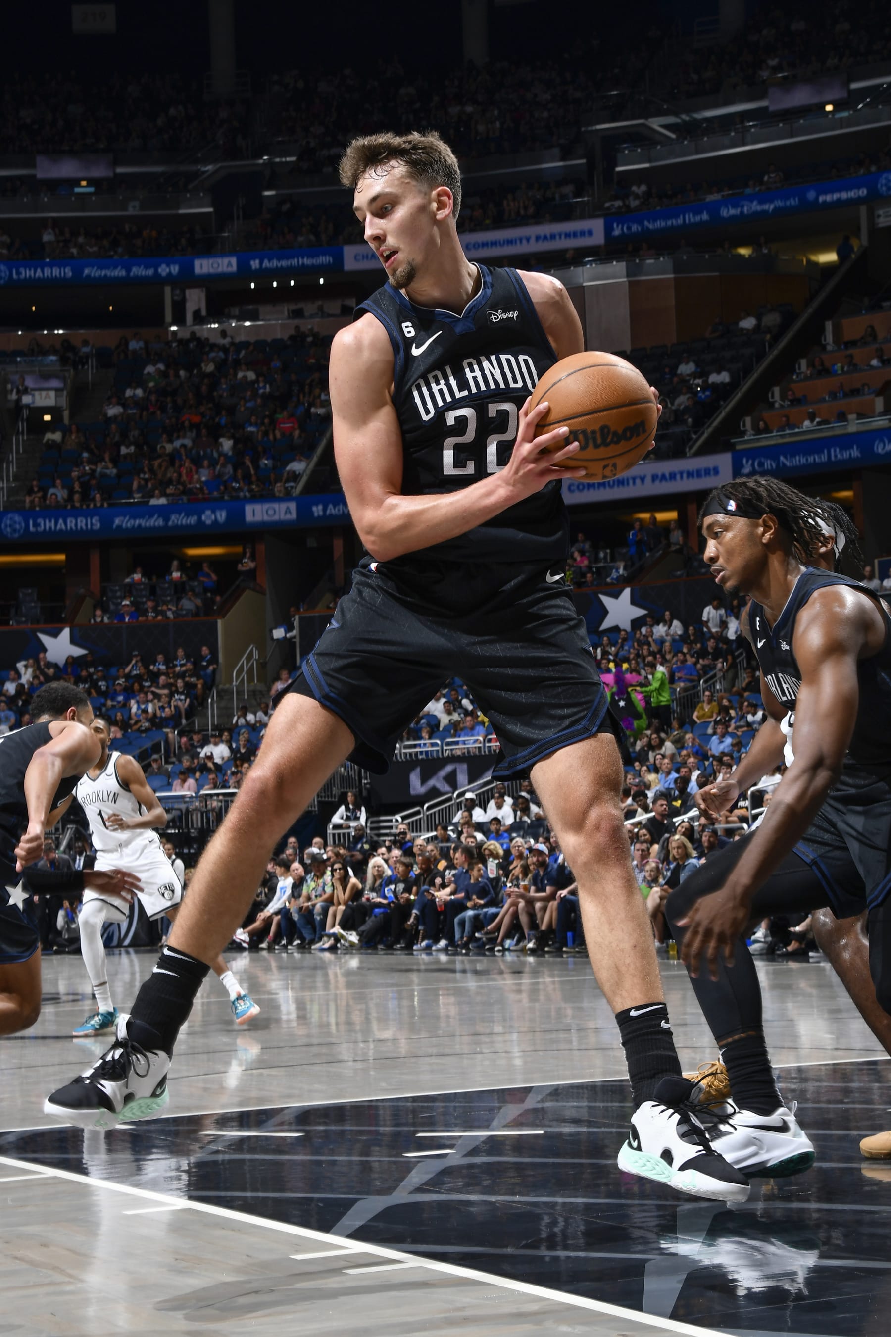 ORLANDO, FL - MARCH 26:  Franz Wagner #22 of the Orlando Magic grabs the rebound during the game on March 26, 2023 at Amway Center in Orlando, Florida. NOTE TO USER: User expressly acknowledges and agrees that, by downloading and or using this photograph, User is consenting to the terms and conditions of the Getty Images License Agreement. Mandatory Copyright Notice: Copyright 2023 NBAE (Photo by Gary Bassing/NBAE via Getty Images)