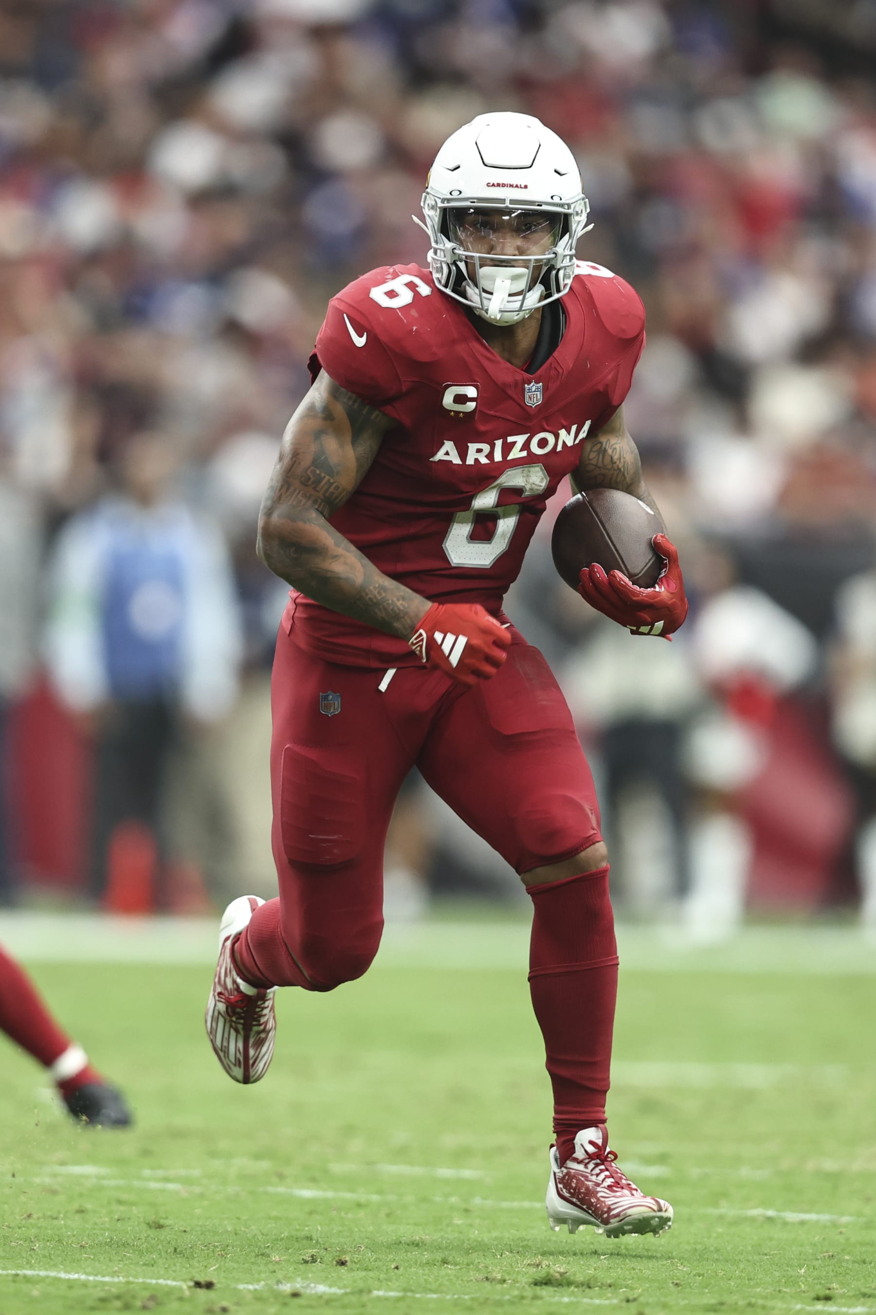 GLENDALE, ARIZONA - SEPTEMBER 17: James Conner #6 of the Arizona Cardinals runs with the ball during an NFL football game between the Arizona Cardinals and the New York Giants at State Farm Stadium on September 17, 2023 in Glendale, Arizona. (Photo by Michael Owens/Getty Images)