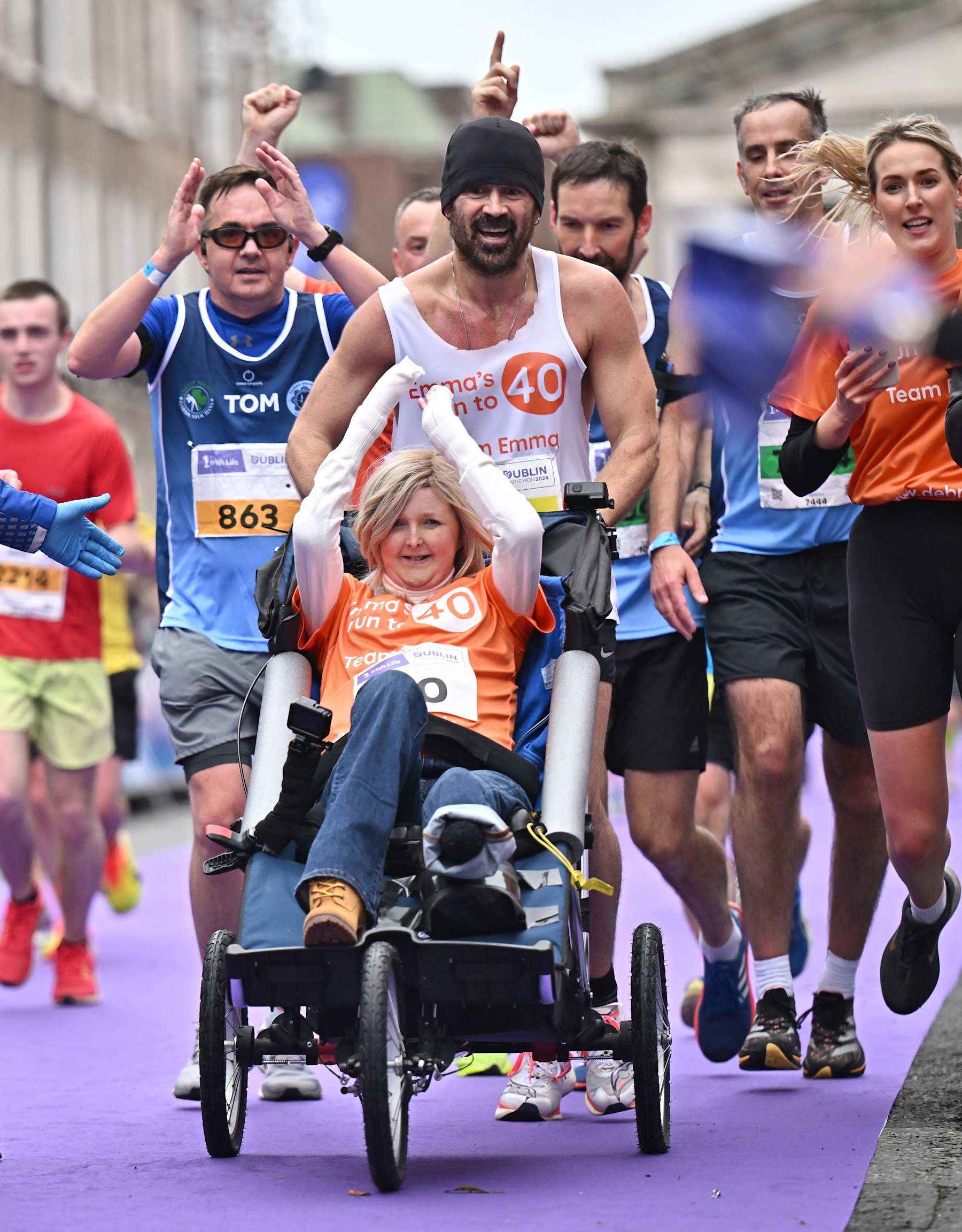 Dublin , Ireland - 27 October 2024; Actor Colin Farrell with Emma Fogerty celebrate on their way to finishing the 2024 Irish Life Dublin Marathon. This marks the 43rd edition of the race with thousands of participants from international athletes, club runners, wheelchair-assisted participants, charity runners, and first-time marathon participants taking on the 26.2-mile challenge. (Photo By Sam Barnes/Sportsfile via Getty Images)