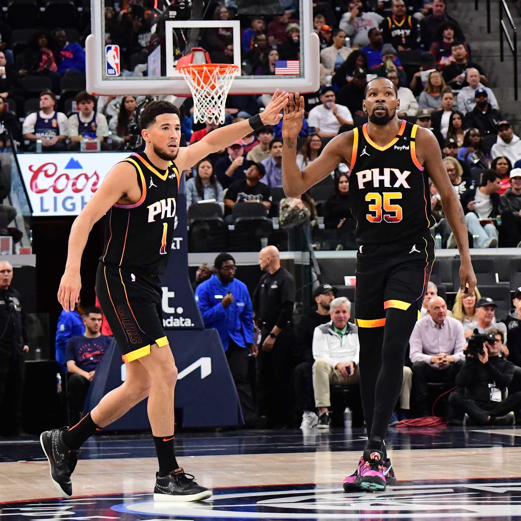 INGLEWOOD, CA - OCTOBER 31: Devin Booker #1 and Kevin Durant #35 of the Phoenix Suns high five during the game against the LA Clippers on October 31, 2024 at Intuit Dome in Los Angeles, California. NOTE TO USER: User expressly acknowledges and agrees that, by downloading and/or using this Photograph, user is consenting to the terms and conditions of the Getty Images License Agreement. Mandatory Copyright Notice: Copyright 2024 NBAE (Photo by Adam Pantozzi/NBAE via Getty Images)