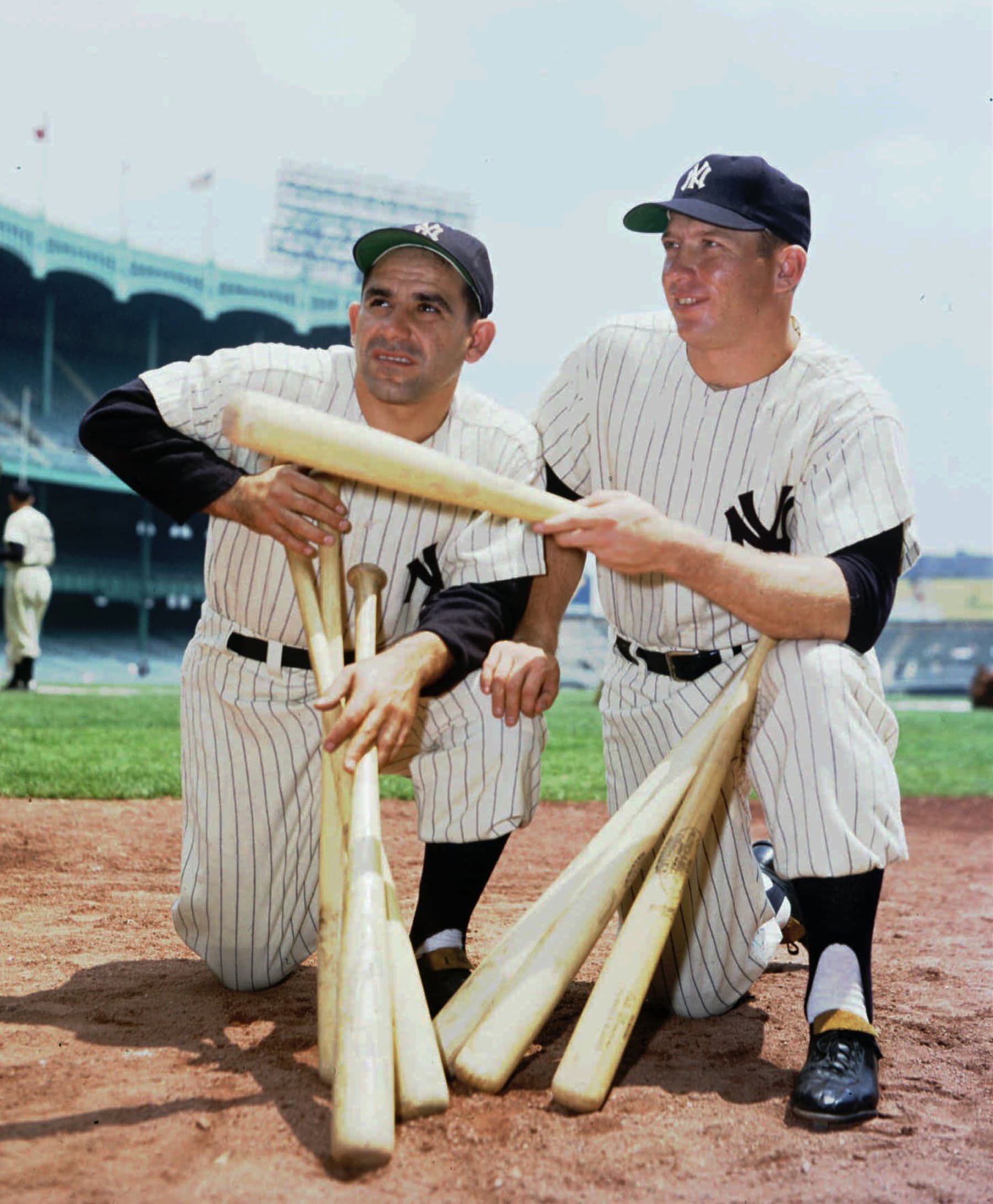 Mickey Mantle, right, poses with Yankee teammate Yogi Berra pose at Yankee Stadium in 1956, Mantle's American League Triple Crown year. (AP Photo)