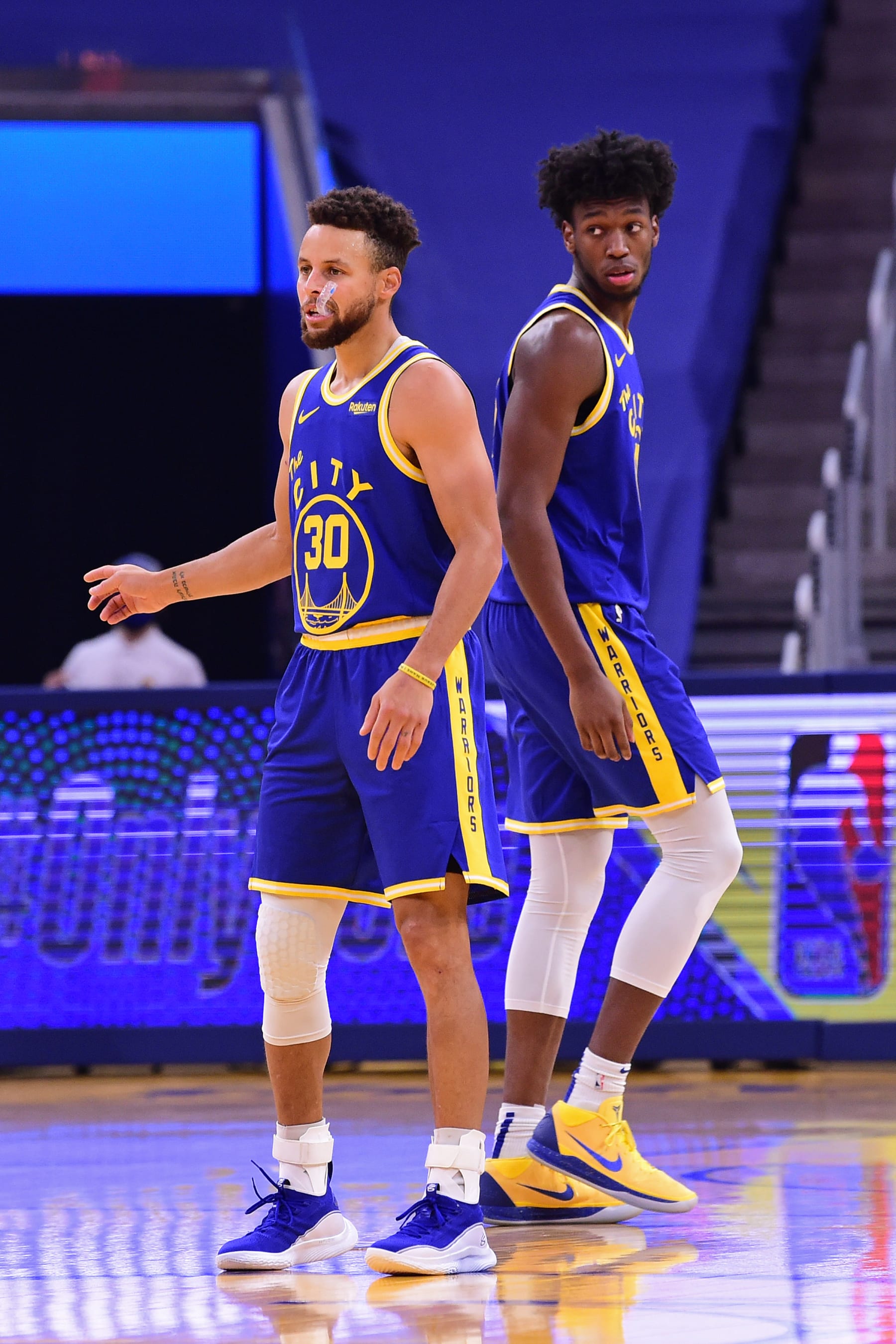 SAN FRANCISCO, CA - January 6: Stephen Curry #30 of the Golden State Warriors and James Wiseman #33 of the Golden State Warriors look on during the game against the LA Clippers on January 6, 2021 at Chase Center in San Francisco, California. NOTE TO USER: User expressly acknowledges and agrees that, by downloading and or using this photograph, user is consenting to the terms and conditions of Getty Images License Agreement. Mandatory Copyright Notice: Copyright 2021 NBAE (Photo by Noah Graham/NBAE via Getty Images)