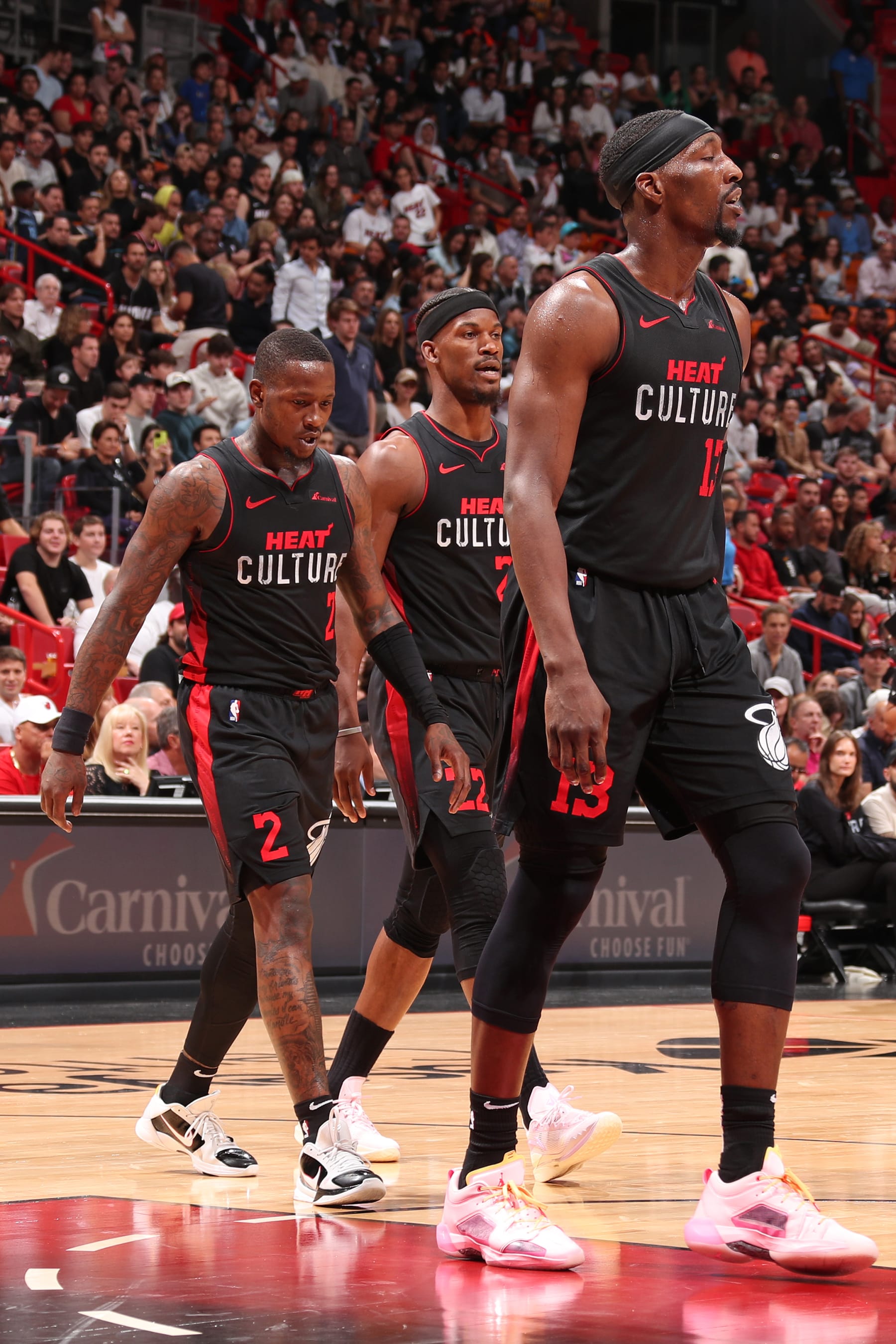 MIAMI, FL - JANUARY 24:  Terry Rozier #2, Jimmy Butler #22, and Bam Adebayo #13 of the Miami Heat walk off the court during the game against the Memphis Grizzlies on January 24, 2024 at Kaseya Center in Miami, Florida. NOTE TO USER: User expressly acknowledges and agrees that, by downloading and or using this Photograph, user is consenting to the terms and conditions of the Getty Images License Agreement. Mandatory Copyright Notice: Copyright 2024 NBAE (Photo by Issac Baldizon/NBAE via Getty Images)