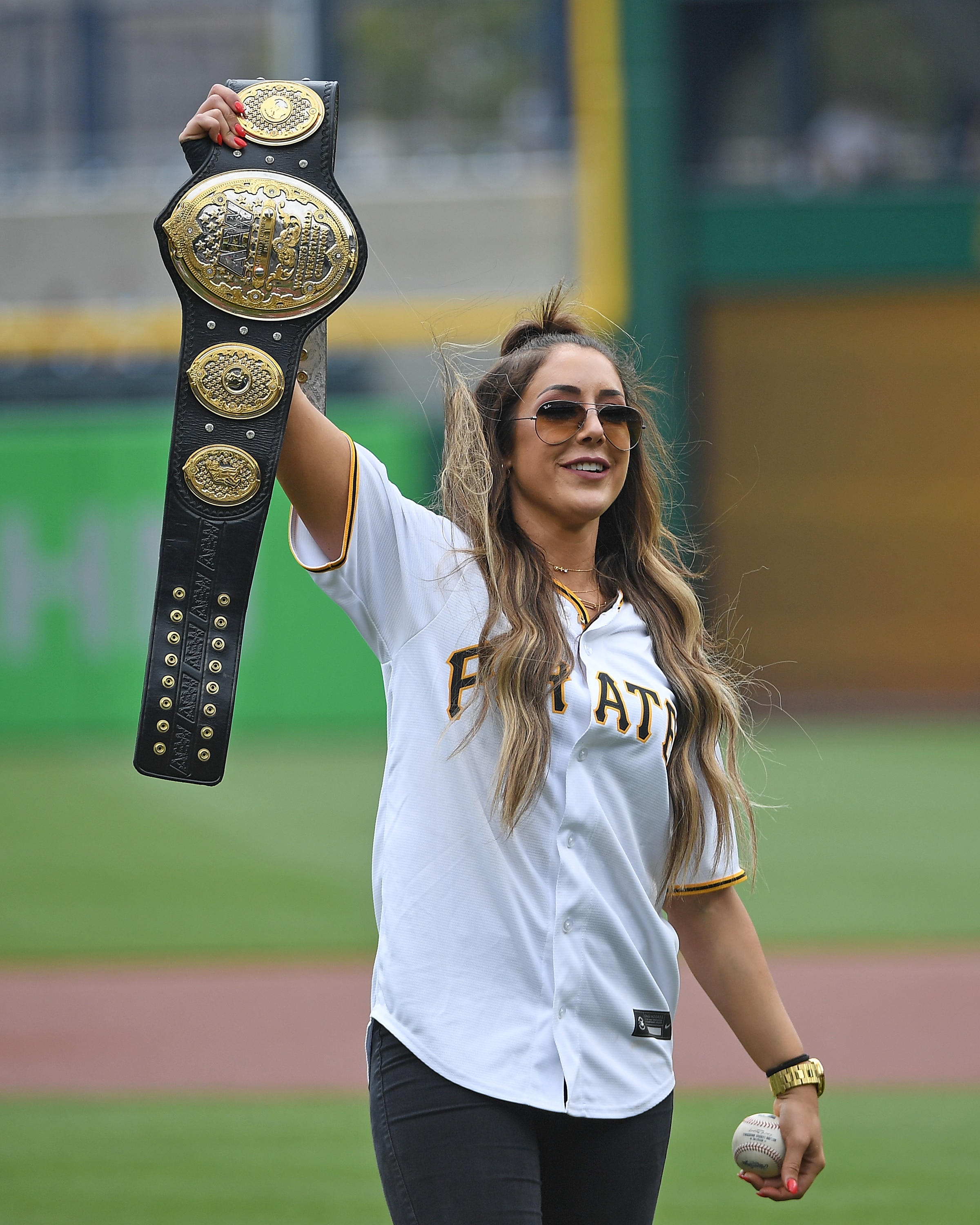 PITTSBURGH, PA - AUGUST 12: All Elite Wrestling Womens World Champion Britt Baker acknowledges the crowd before throwing out a first pitch before the game between the Pittsburgh Pirates and the St. Louis Cardinals at PNC Park on August 12, 2021 in Pittsburgh, Pennsylvania. (Photo by Justin Berl/Getty Images)