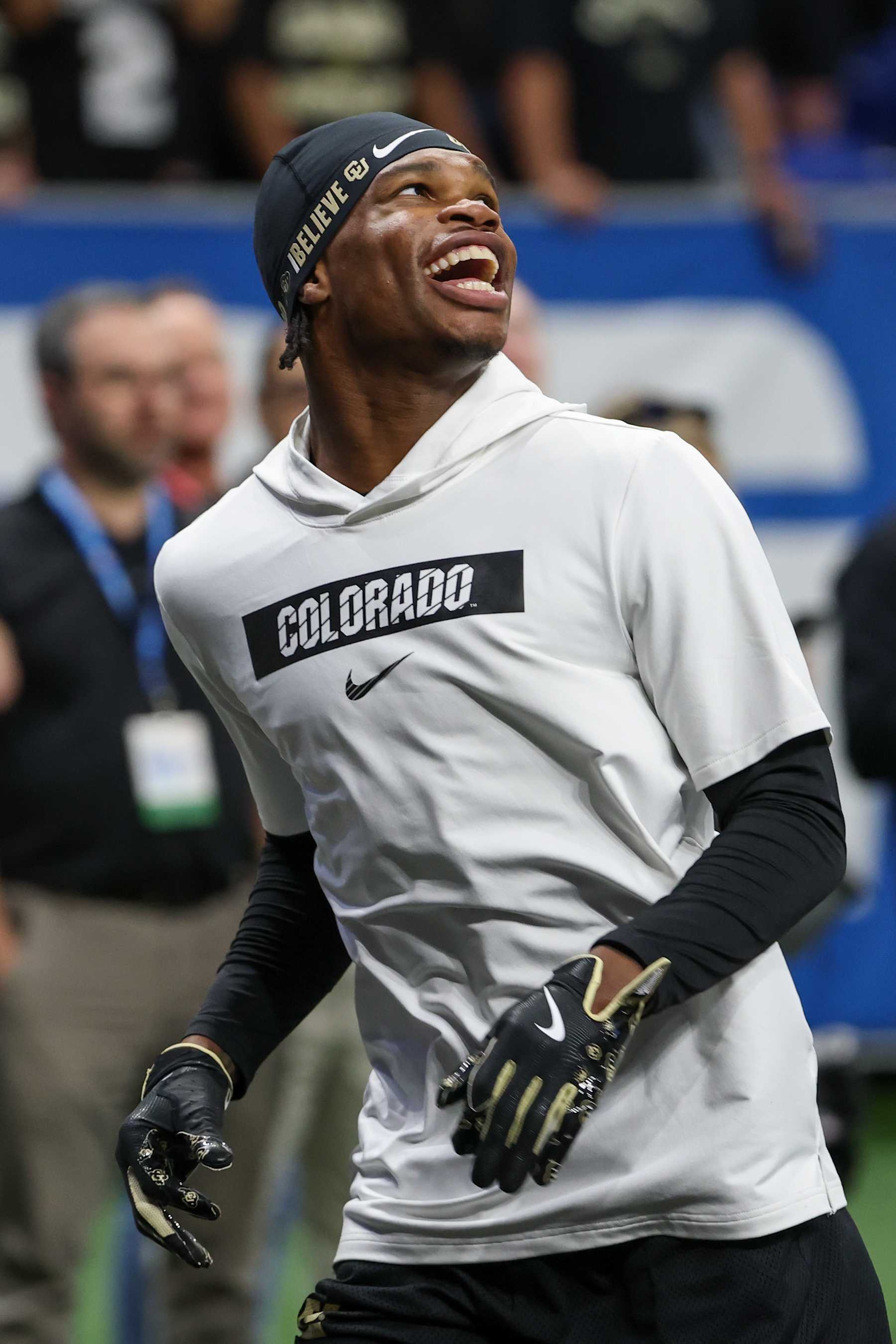 SAN ANTONIO, TX - DECEMBER 28: Colorado Buffaloes wide receiver Travis Hunter (12) smiles as he practices one-hand catches before the football game between BYU Cougars and Colorado Buffalos on December 28, 2024, at the Alamodome in San Antonio, Texas. (Photo by David Buono/Icon Sportswire via Getty Images)