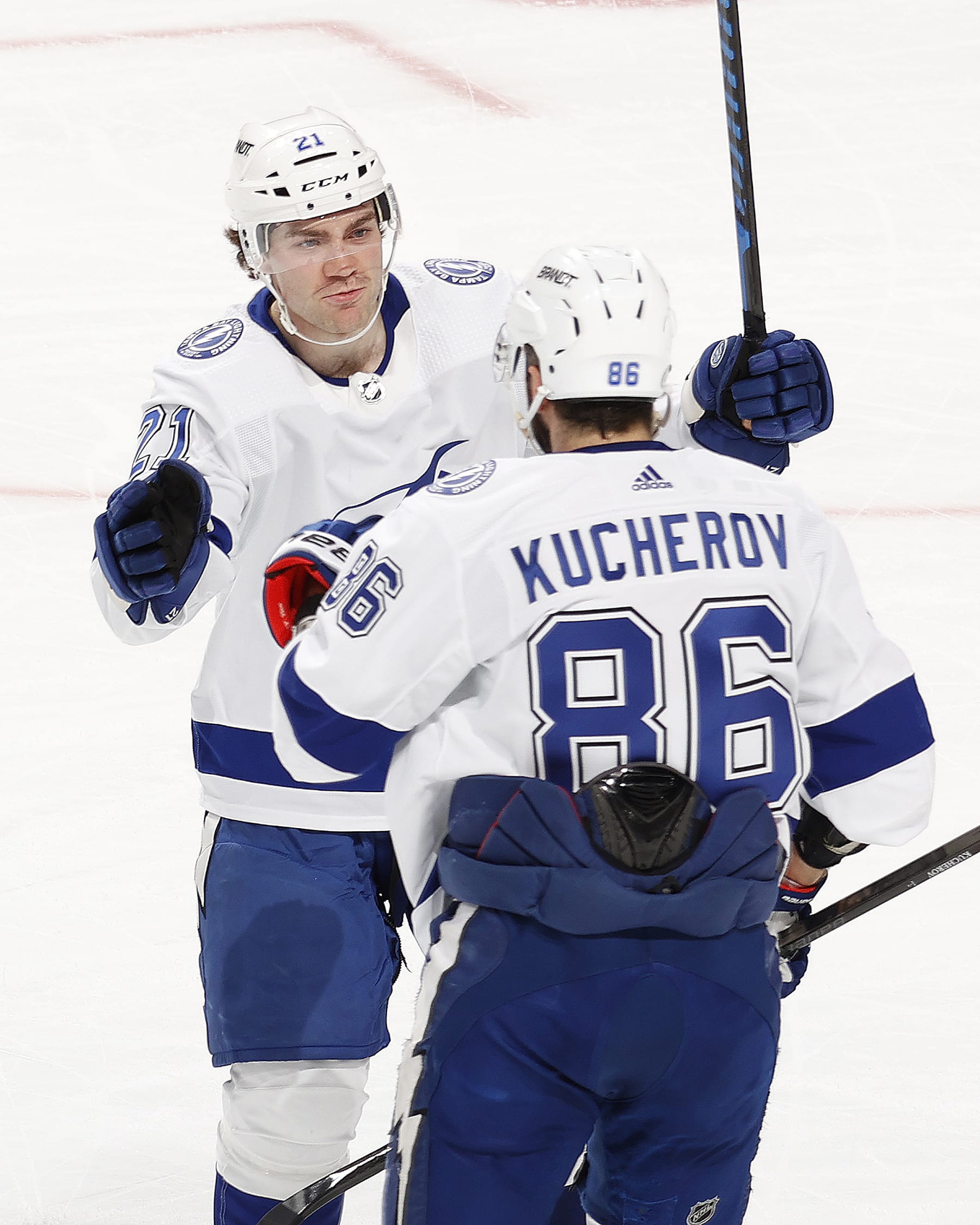 SUNRISE, FL - MARCH 16: Nikita Kucherov #86 is congratulated by Brayden Point #21 of the Tampa Bay Lightning after he scored an empty net goal against the Florida Panthers at the Amerant Bank Arena on March 16, 2024 in Sunrise, Florida. (Photo by Joel Auerbach/Getty Images)