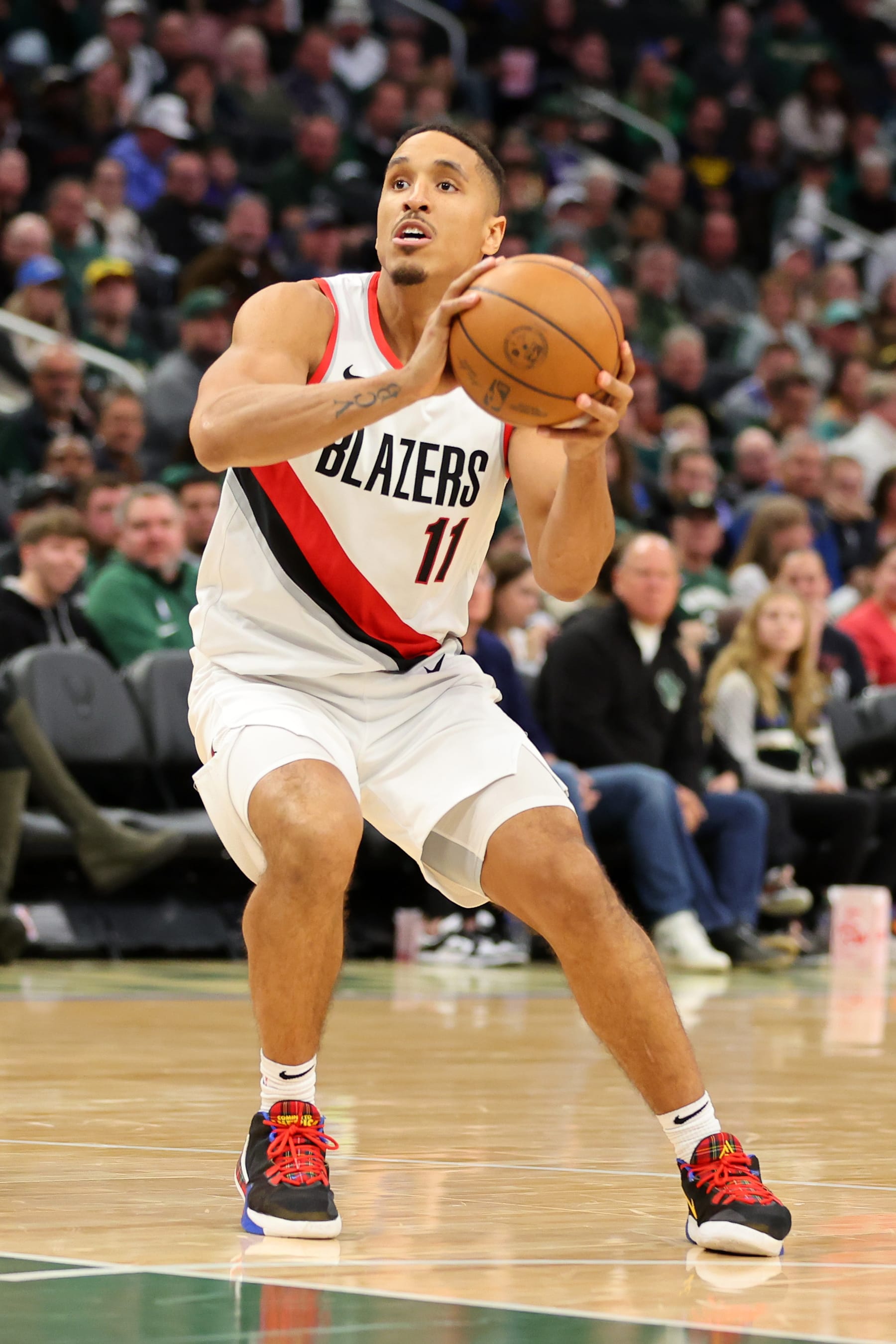 MILWAUKEE, WISCONSIN - NOVEMBER 26: Malcolm Brogdon #11 of the Portland Trail Blazers handles the ball during a game against the Milwaukee Bucks at Fiserv Forum on November 26, 2023 in Milwaukee, Wisconsin. NOTE TO USER: User expressly acknowledges and agrees that, by downloading and or using this photograph, User is consenting to the terms and conditions of the Getty Images License Agreement. (Photo by Stacy Revere/Getty Images)
