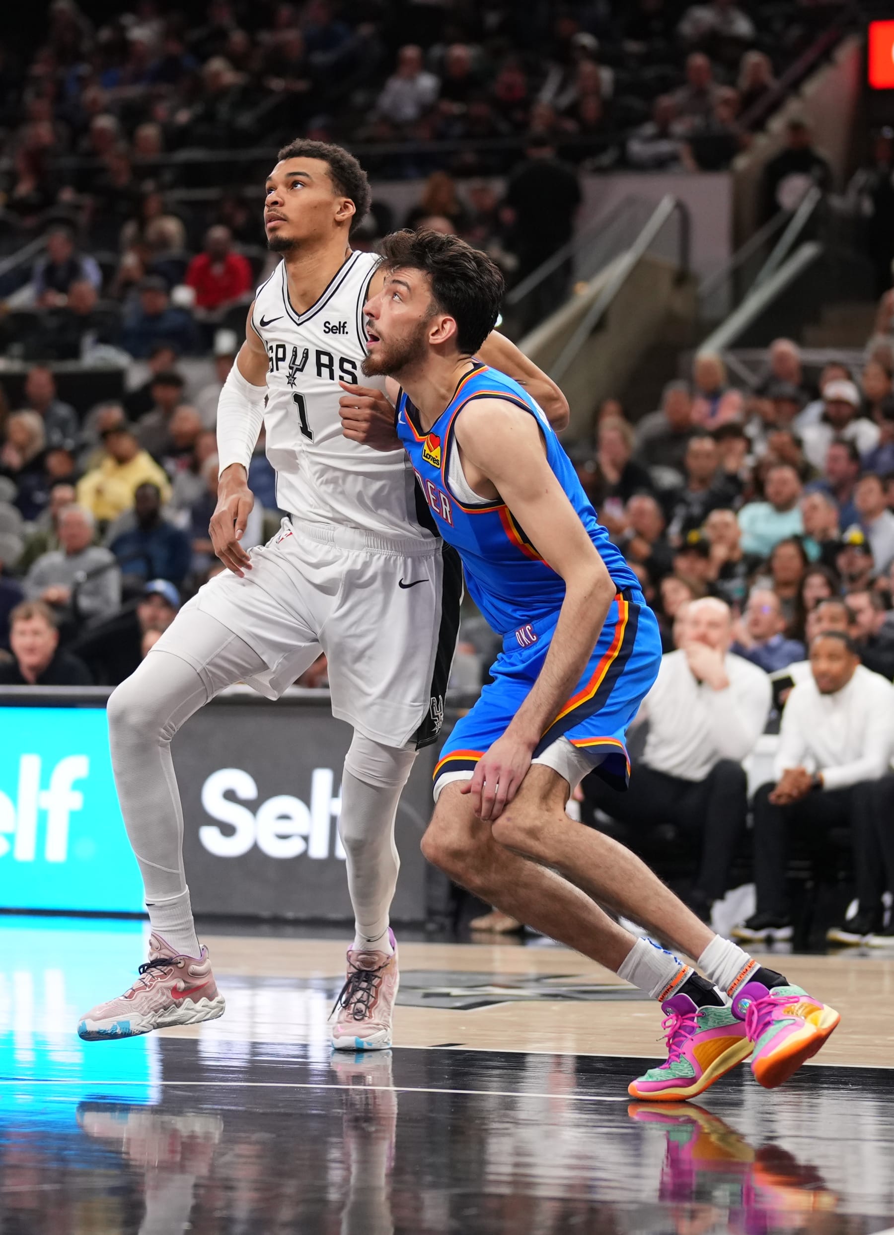 SAN ANTONIO, TX - FEBRUARY 29: Victor Wembanyama #1 of the San Antonio Spurs and Chet Holmgren #7 of the Oklahoma City Thunder waits for a rebound during the game on February 29, 2024 at the Frost Bank Center in San Antonio, Texas. NOTE TO USER: User expressly acknowledges and agrees that, by downloading and or using this photograph, user is consenting to the terms and conditions of the Getty Images License Agreement. Mandatory Copyright Notice: Copyright 2024 NBAE (Photos by Darren Carroll/NBAE via Getty Images)