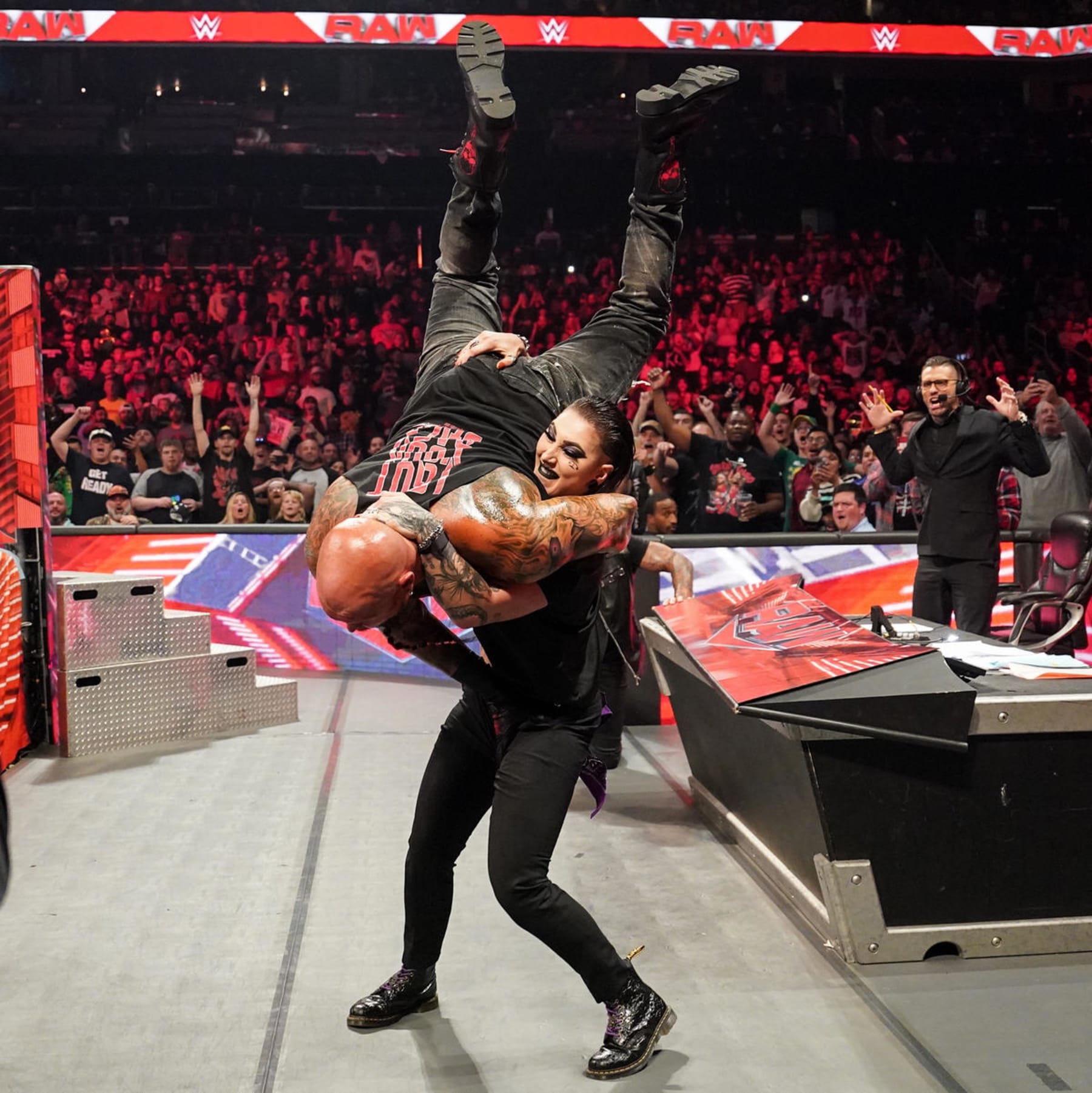 Rhea Ripley effortlessly lifts and slams Luke Gallows, a man twice her weight.