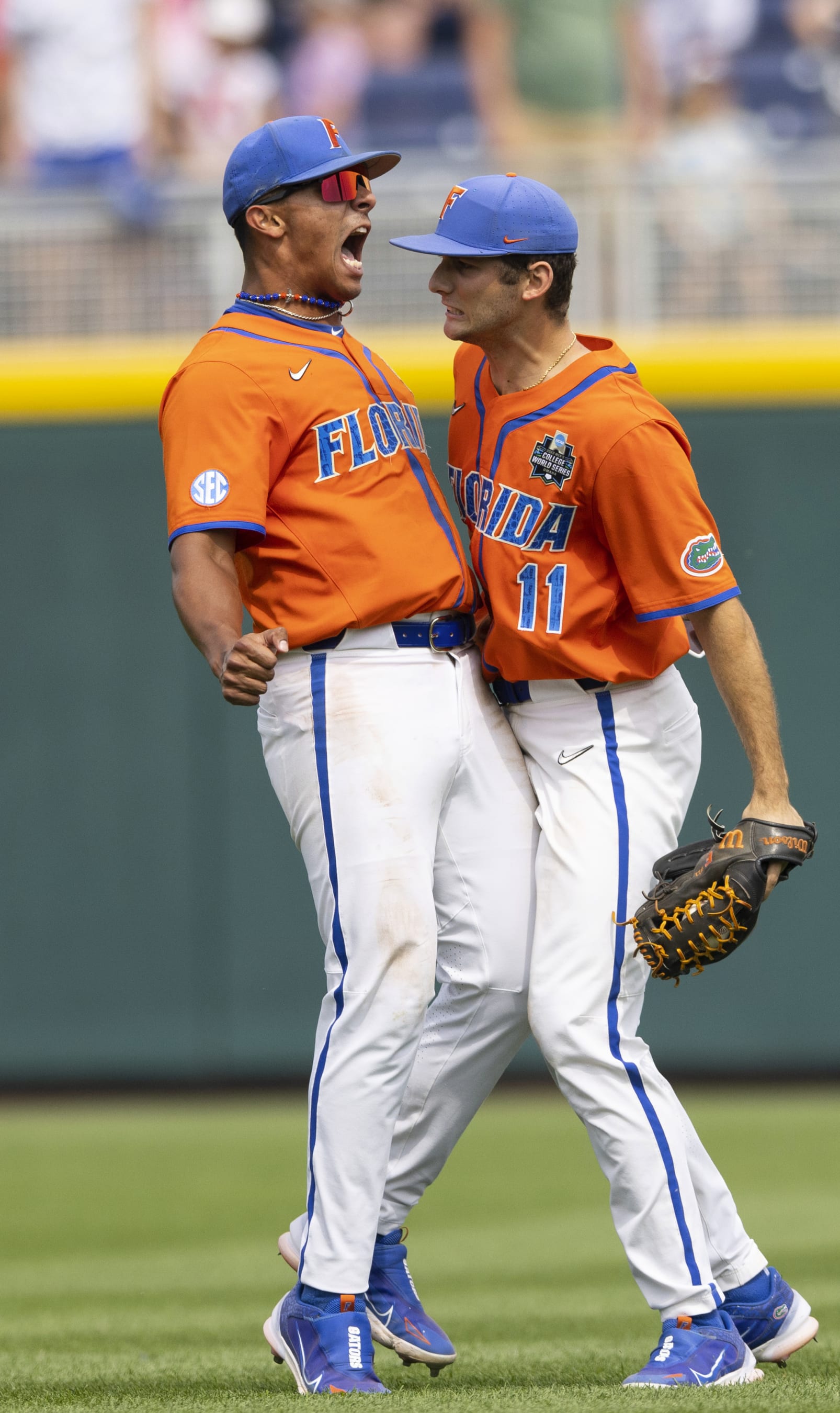 Florida's Josh Rivera, left, celebrates with Michael Robertson following their win against TCU in a baseball game at the NCAA College World Series in Omaha, Neb., Wednesday, June 21, 2023. Florida defeated TCU 3-2. (AP Photo/Rebecca S. Gratz)