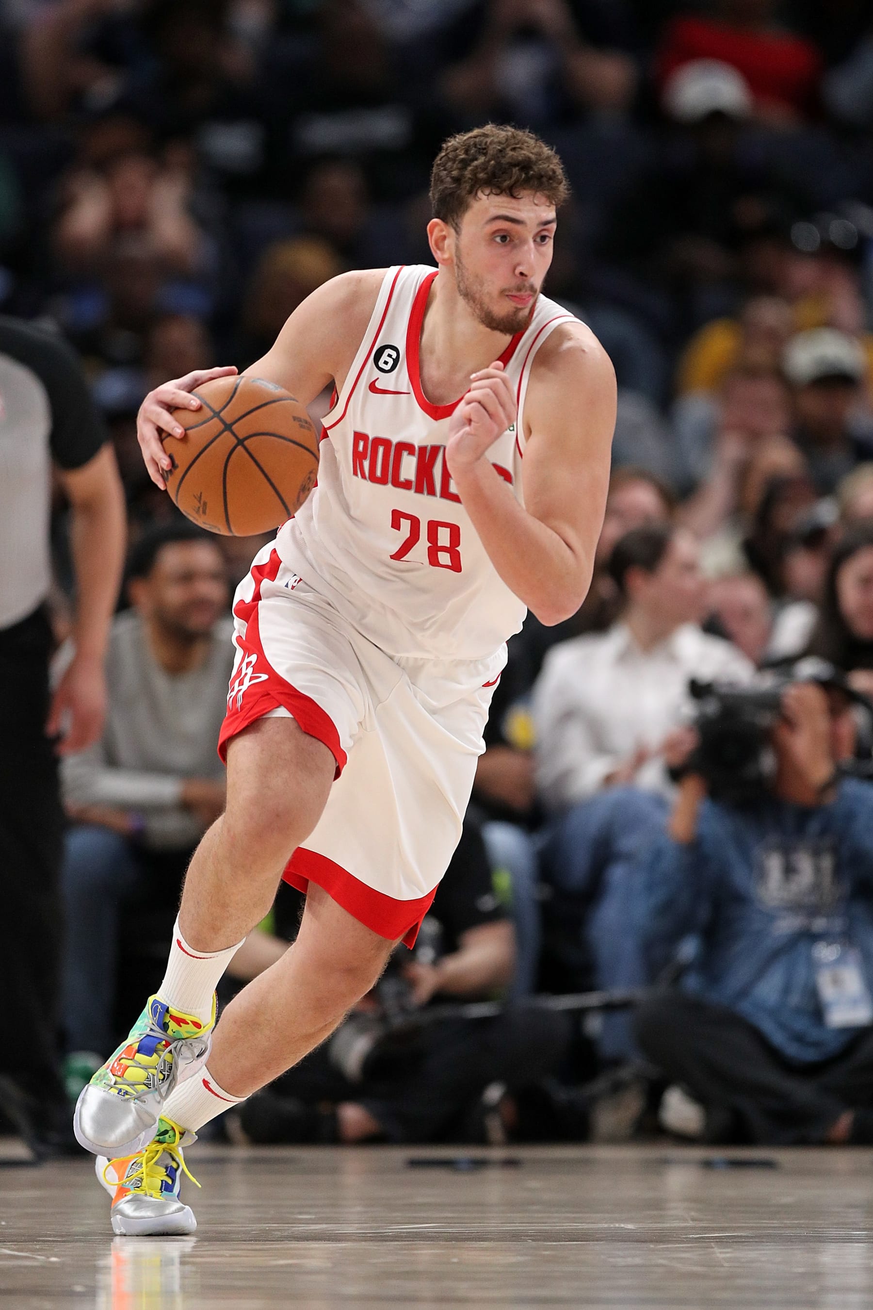 MEMPHIS, TENNESSEE - MARCH 22: Alperen Sengun #28 of the Houston Rockets brings the ball up court during the game against the Memphis Grizzlies at FedExForum on March 22, 2023 in Memphis, Tennessee. NOTE TO USER: User expressly acknowledges and agrees that, by downloading and or using this photograph, User is consenting to the terms and conditions of the Getty Images License Agreement. (Photo by Justin Ford/Getty Images)