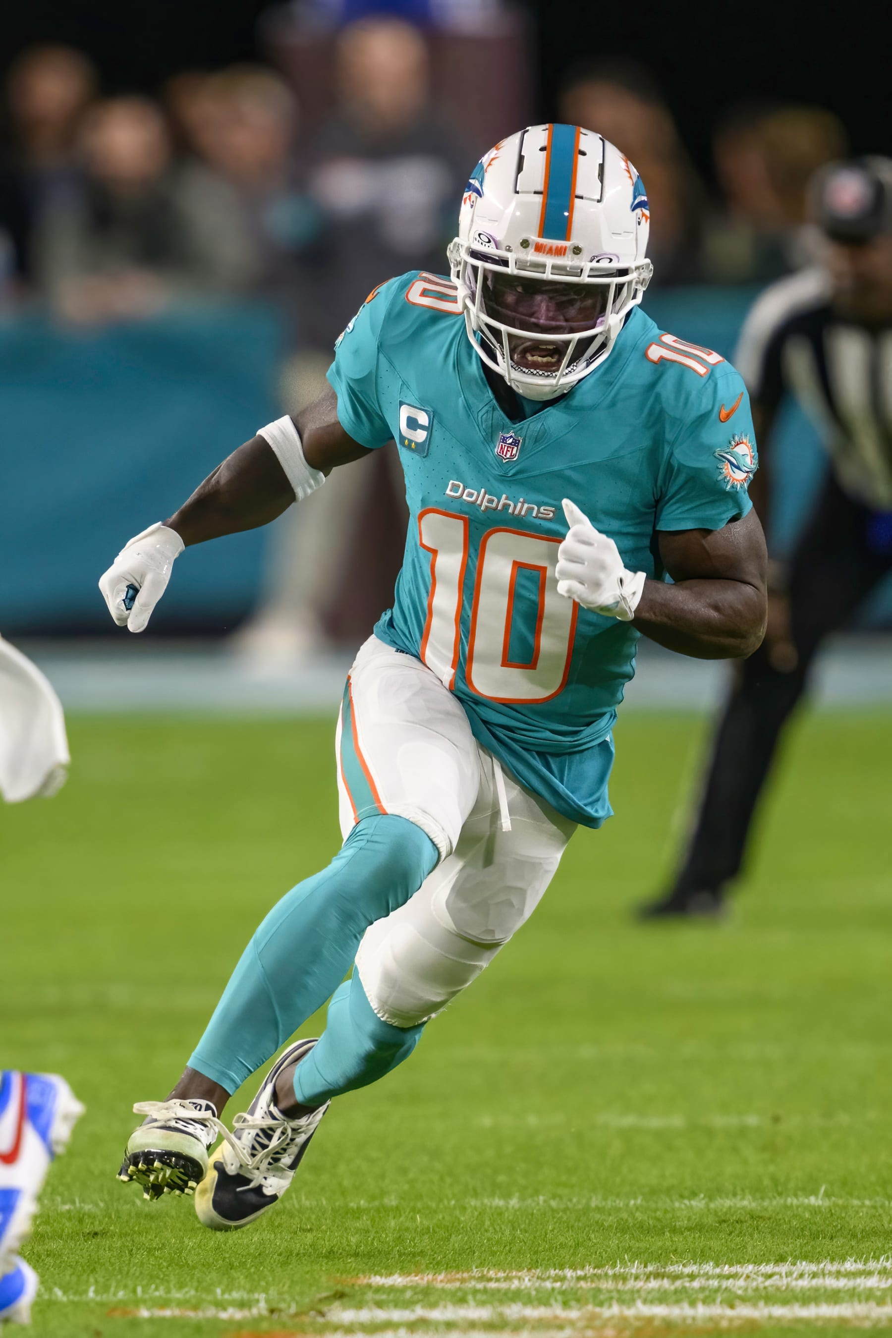 Miami Dolphins wide receiver Tyreek Hill (10) runs a play during an NFL football game against the Tennessee Titans Monday, Dec. 12, 2023, in Miami Gardens, Fla. (AP Photo/Doug Murray)