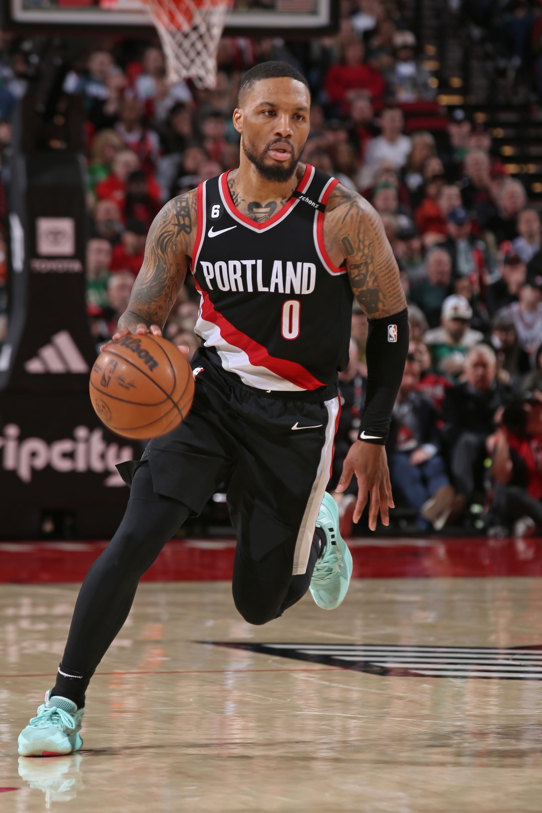 PORTLAND, OR - MARCH 17: Damian Lillard #0 of the Portland Trail Blazers dribbles the ball during the game against the Boston Celtics on March 17, 2023 at the Moda Center Arena in Portland, Oregon. NOTE TO USER: User expressly acknowledges and agrees that, by downloading and or using this photograph, user is consenting to the terms and conditions of the Getty Images License Agreement. Mandatory Copyright Notice: Copyright 2023 NBAE (Photo by Cameron Browne/NBAE via Getty Images)