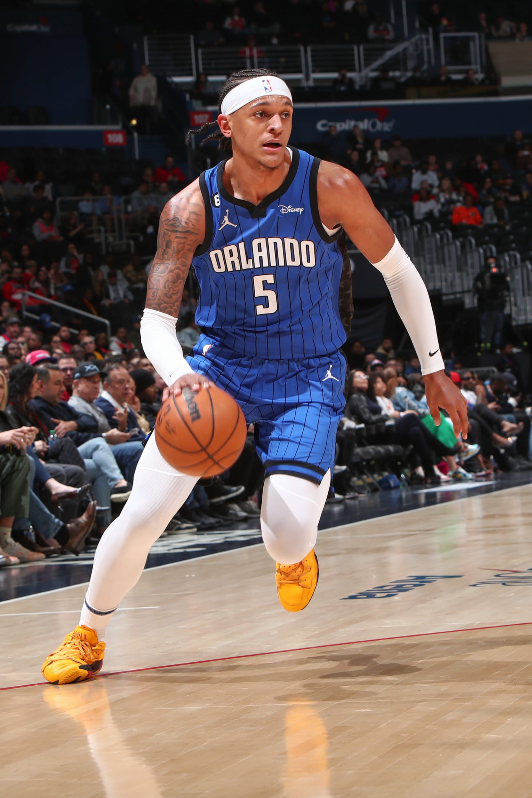 WASHINGTON, DC -  MARCH 31:  Paolo Banchero #5 of the Orlando Magic goes to the basket during the game on March 31, 2023 at Capital One Arena in Washington, DC. NOTE TO USER: User expressly acknowledges and agrees that, by downloading and or using this Photograph, user is consenting to the terms and conditions of the Getty Images License Agreement. Mandatory Copyright Notice: Copyright 2023 NBAE (Photo by Kenny Giarla/NBAE via Getty Images)
