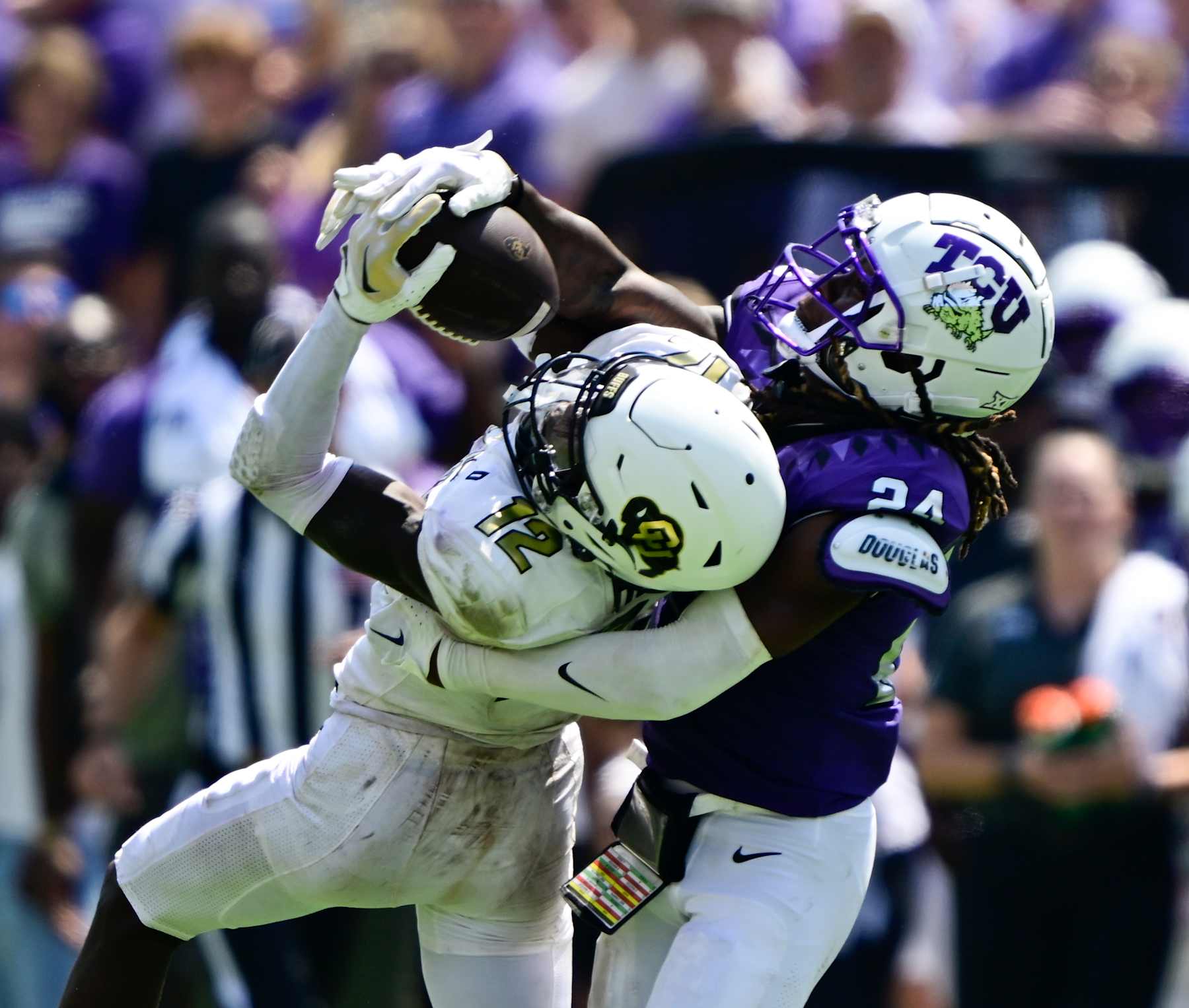 FT. WORTH, TX - SEPTEMBER 02: Colorado Buffaloes cornerback Travis Hunter (12) makes a long reception against TCU Horned Frogs cornerback Avery Helm (24) in the fourth quarter at Amon G. Carter Stadium in Ft. Worth September 02, 2023. (Photo by Andy Cross/MediaNews Group/The Denver Post via Getty Images)
