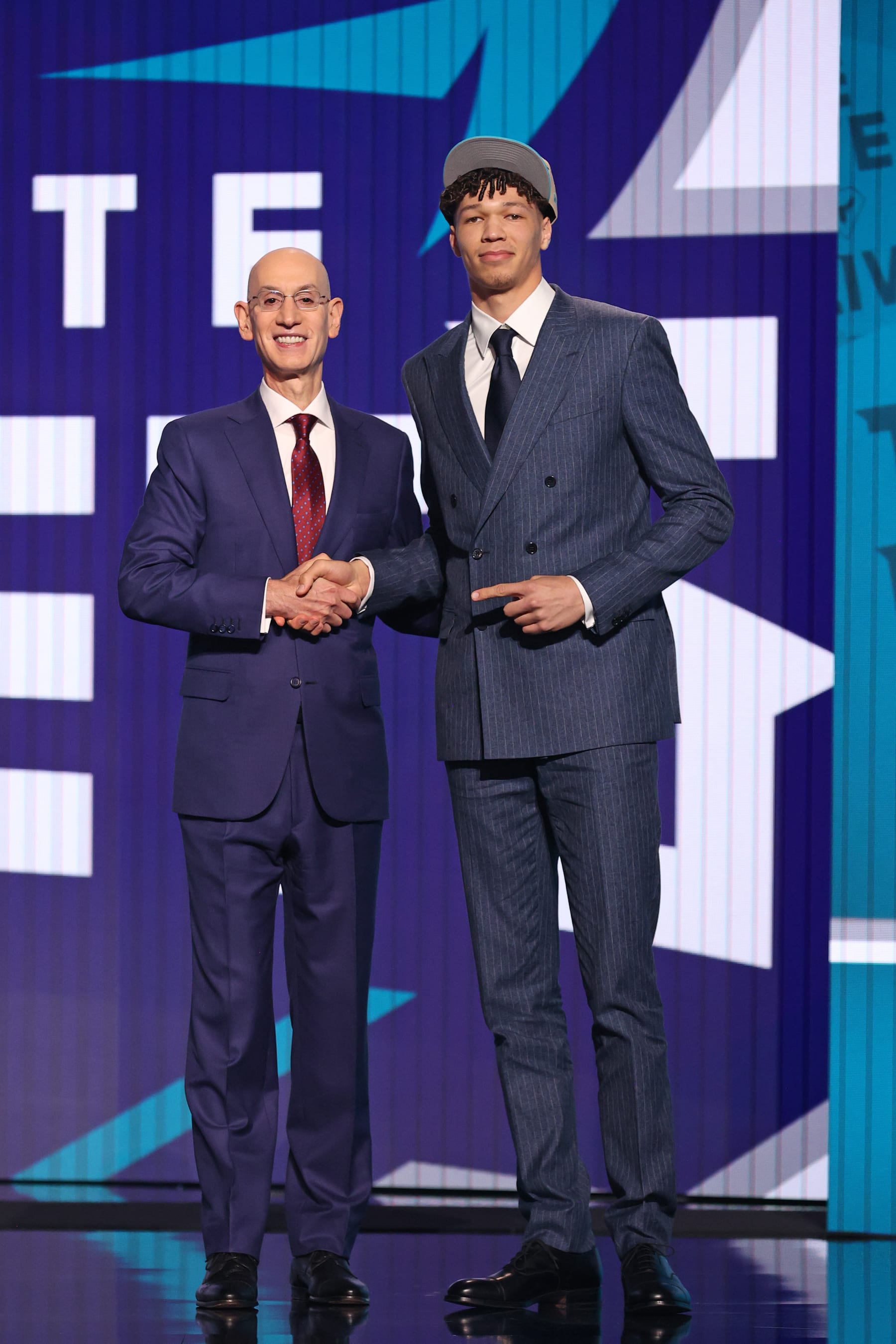 BROOKLYN, NY - JUNE 26: NBA Commissioner, Adam Silver poses for a photo with Tidjane Salaun after being drafted sixth overall by the Charlotte Hornets during the 2024 NBA Draft - Round One on June 26, 2024 at Barclays Center in Brooklyn, New York. NOTE TO USER: User expressly acknowledges and agrees that, by downloading and or using this photograph, User is consenting to the terms and conditions of the Getty Images License Agreement. Mandatory Copyright Notice: Copyright 2024 NBAE (Photo by Nathaniel S. Butler/NBAE via Getty Images)
