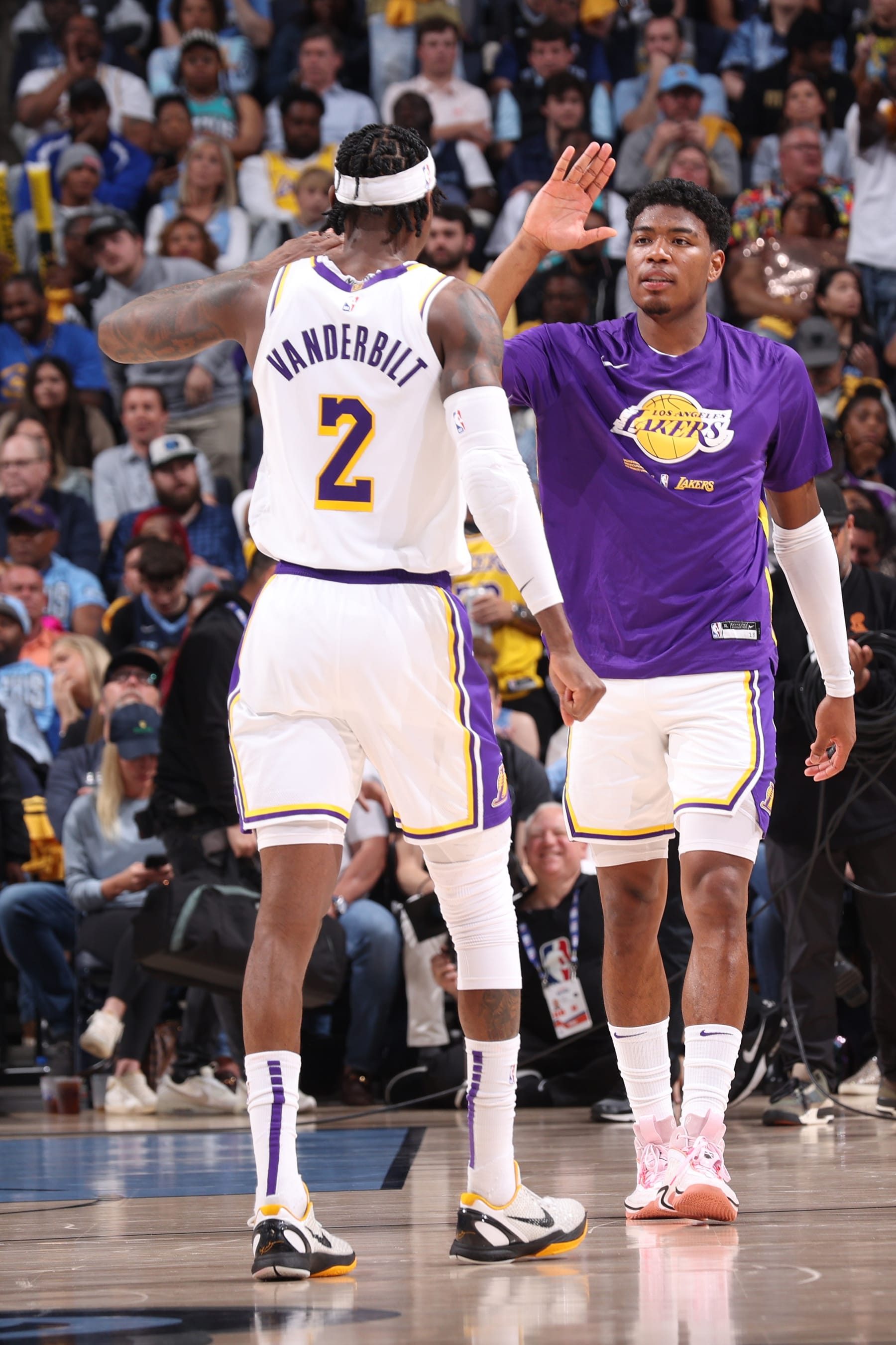 MEMPHIS, TN - APRIL 16: Jarred Vanderbilt #2 and Rui Hachimura #28 of the Los Angeles Lakers high five against the Miami Heat during Round 1 Game 1 of the NBA Playoffs on April 16, 2023 at FedExForum in Memphis, Tennessee. NOTE TO USER: User expressly acknowledges and agrees that, by downloading and or using this photograph, User is consenting to the terms and conditions of the Getty Images License Agreement. Mandatory Copyright Notice: Copyright 2023 NBAE (Photo by Joe Murphy/NBAE via Getty Images)