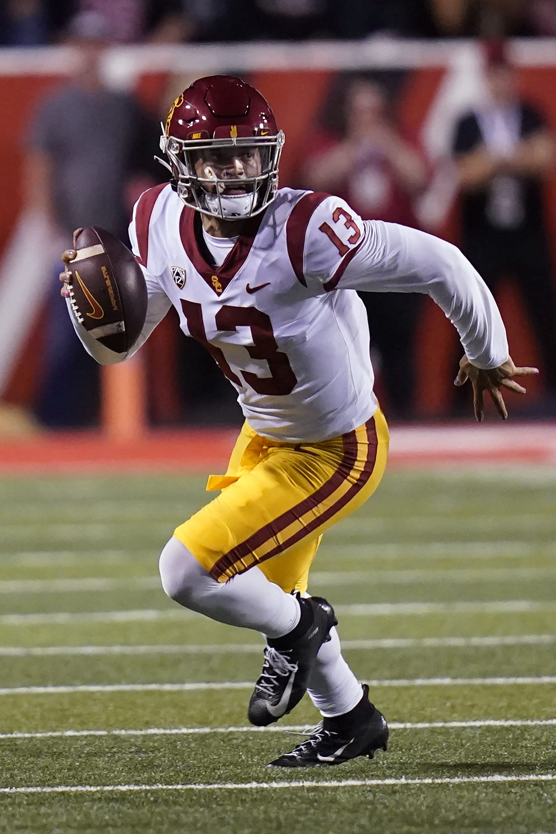 Southern California quarterback Caleb Williams carries the ball during the first half of the team's NCAA college football game against Utah on Saturday, Oct. 15, 2022, in Salt Lake City. (AP Photo/Rick Bowmer)