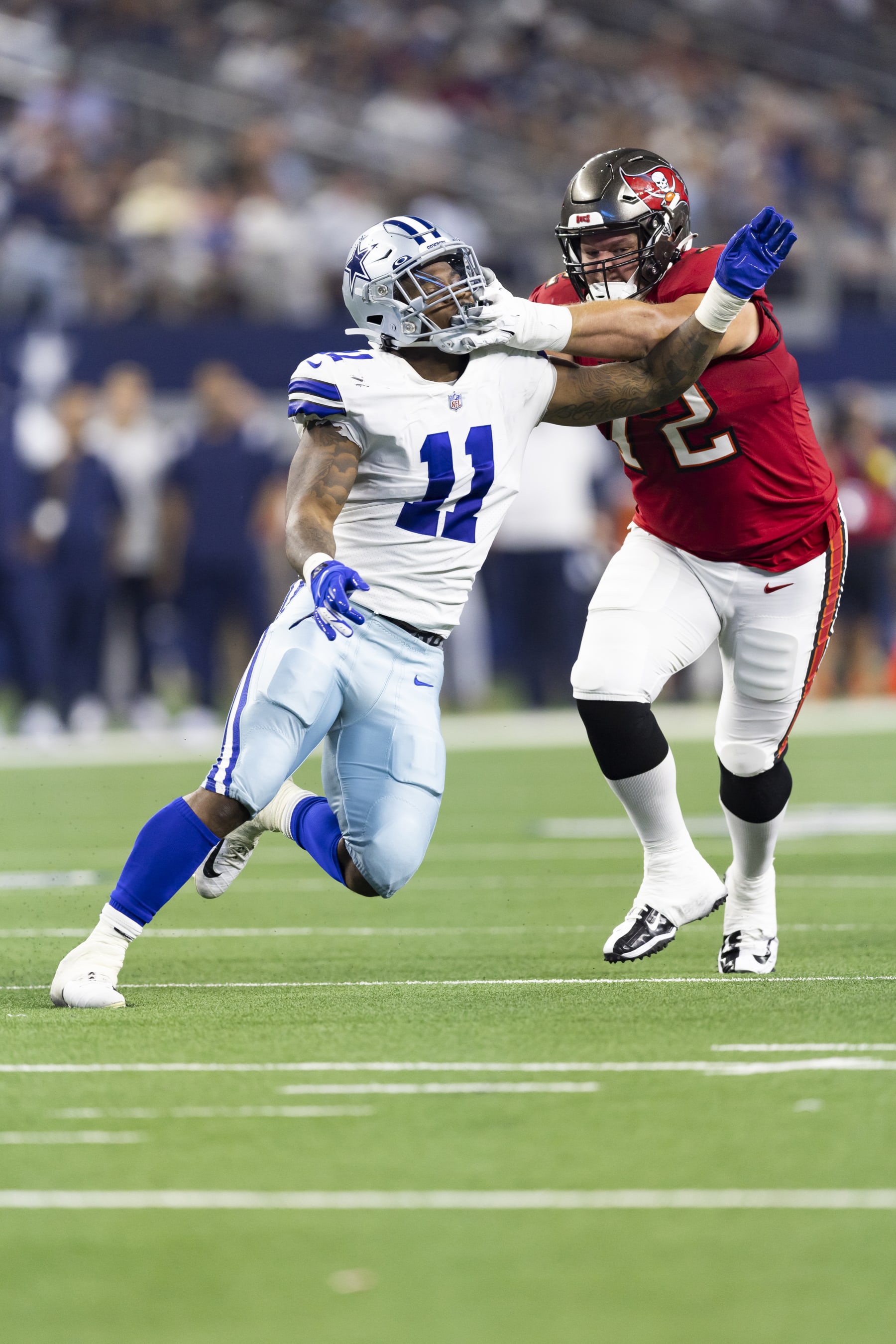 Dallas Cowboys linebacker Micah Parsons (11) battles Tampa Bay Buccaneers offensive tackle Josh Wells (72) during an NFL football game, Sunday, Sept. 11, 2022, in Arlington, Texas. Tampa Bay won 19-3. (AP Photo/Brandon Wade)