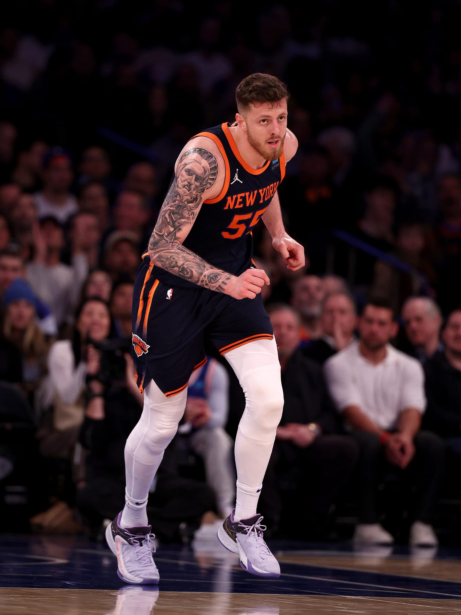 NEW YORK, NEW YORK - FEBRUARY 06:  Isaiah Hartenstein #55 of the New York Knicks celebrates his shot in the second half against the Memphis Grizzlies at Madison Square Garden on February 06, 2024 in New York City. NOTE TO USER: User expressly acknowledges and agrees that, by downloading and or using this photograph, User is consenting to the terms and conditions of the Getty Images License Agreement. (Photo by Elsa/Getty Images)