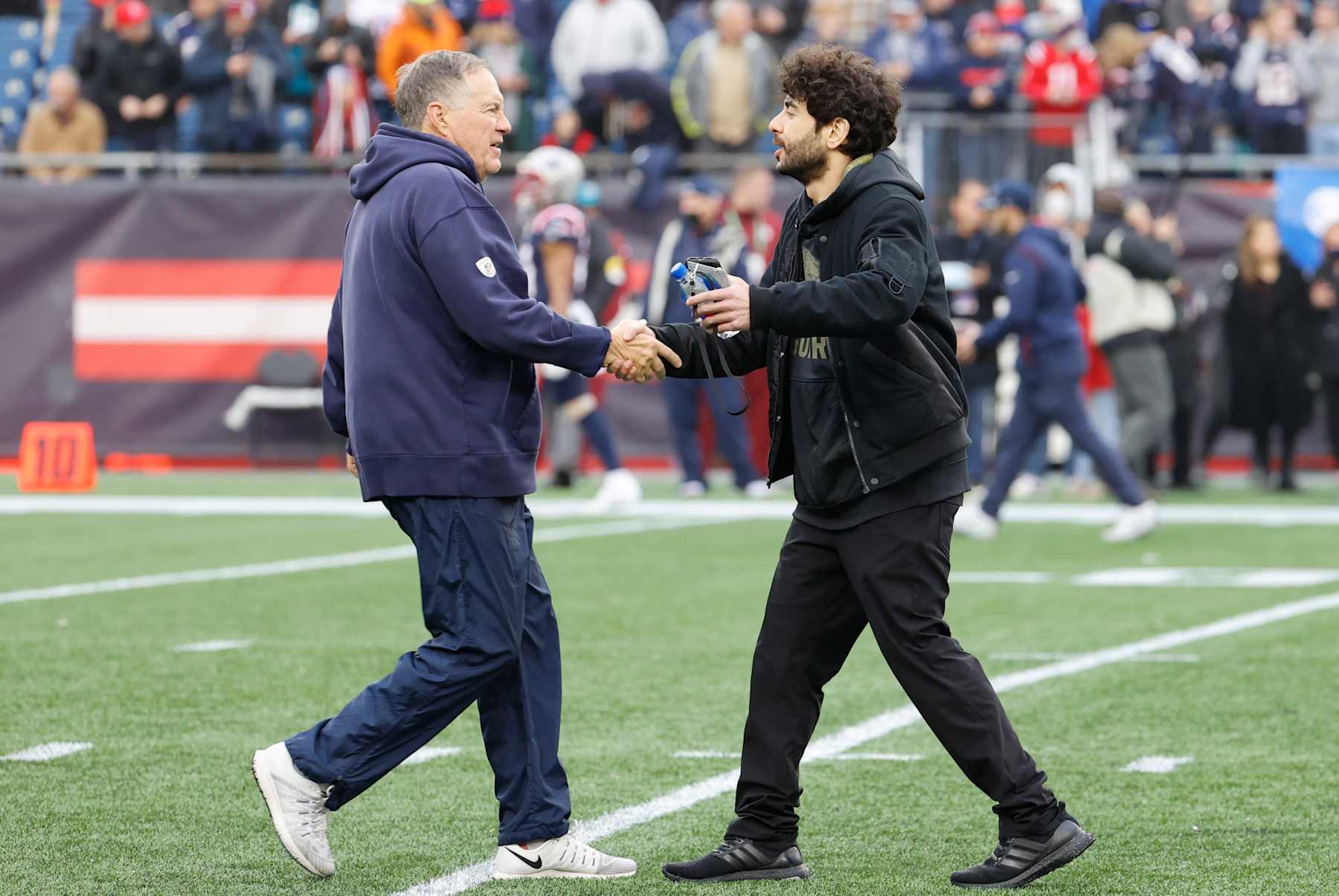 FOXBOROUGH, MA - JANUARY 02: New England Patriots head coach Bill Belichick greets Tony Khan before a game between the New England Patriots and the Jacksonville Jaguars on January 2, 2022, at Gillette Stadium in Foxborough, Massachusetts. (Photo by Fred Kfoury III/Icon Sportswire via Getty Images)