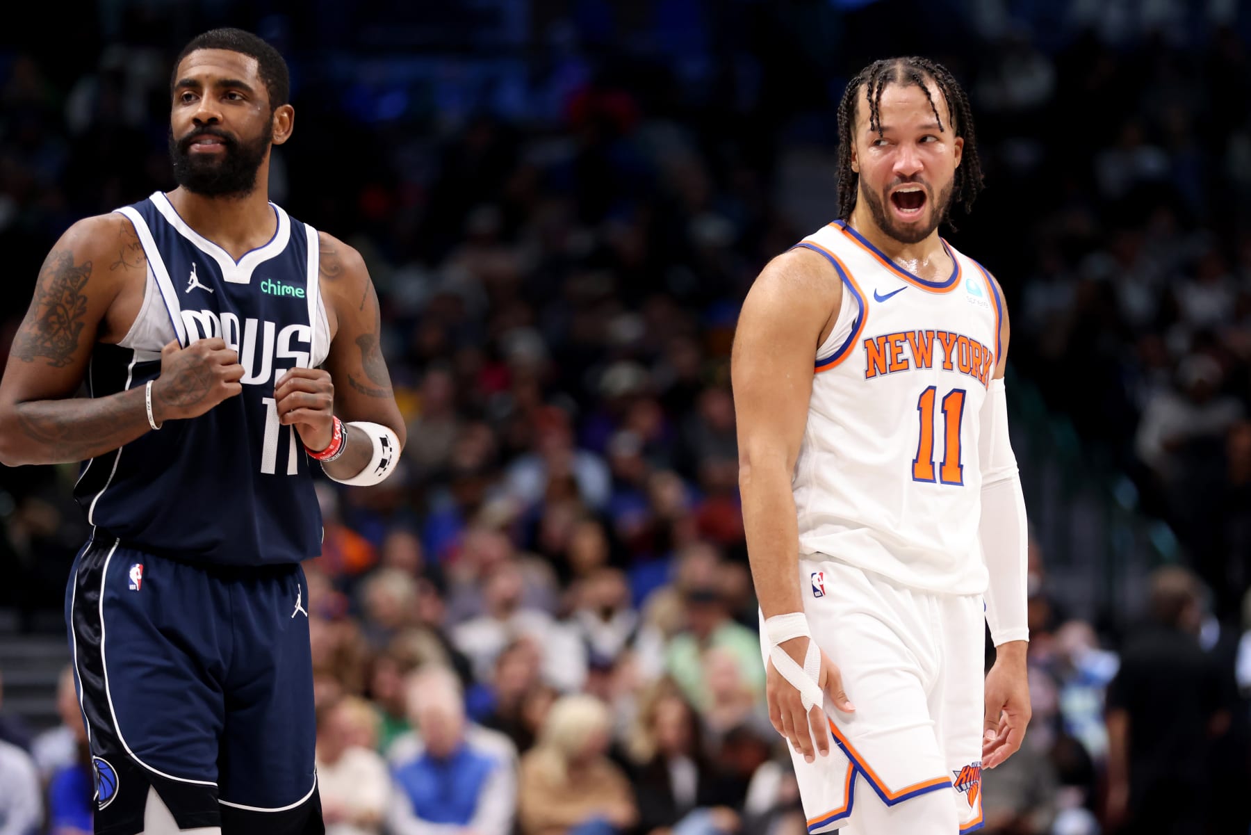 DALLAS, TEXAS - JANUARY 11: Jalen Brunson #11 of the New York Knicks talks to Kyrie Irving #11 of the Dallas Mavericks in the first half at American Airlines Center on January 11, 2024 in Dallas, Texas.  NOTE TO USER: User expressly acknowledges and agrees that, by downloading and or using this photograph, User is consenting to the terms and conditions of the Getty Images License Agreement. (Photo by Tim Heitman/Getty Images)