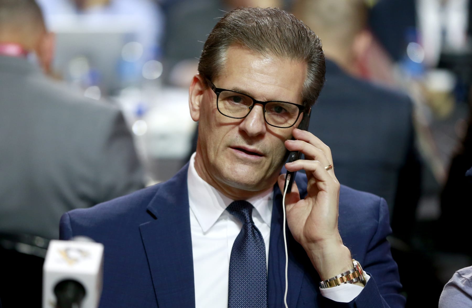 MONTREAL, QUEBEC - JULY 08: General manager Ron Hextall of the Pittsburgh Penguins talks on his phone at the draft table during the first round of the 2022 Upper Deck NHL Draft at Bell Centre on July 07, 2022 in Montreal, Quebec. (Photo by Jeff Vinnick/NHLI via Getty Images)