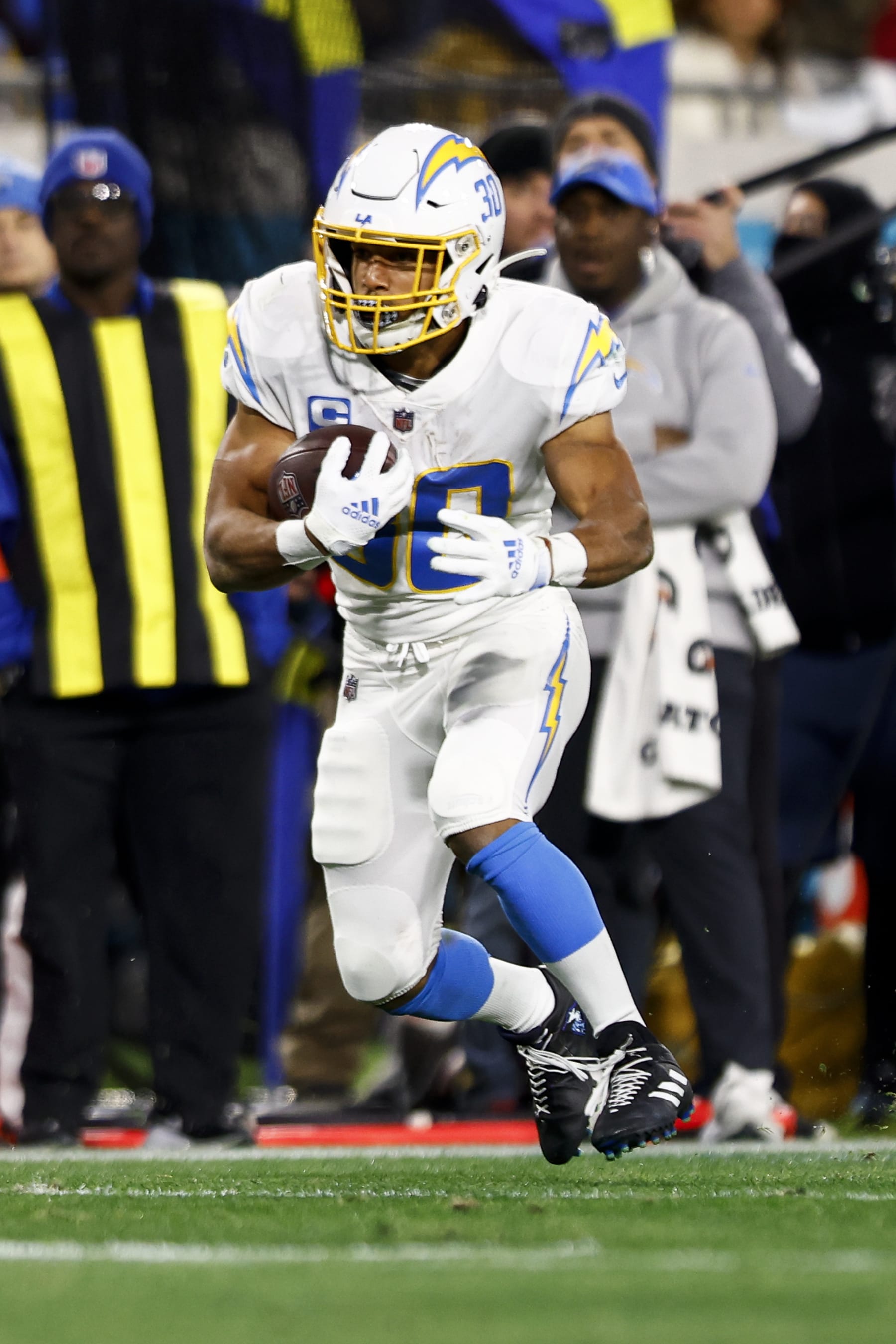 JACKSONVILLE, FL - JANUARY 14: Austin Ekeler #30 of the Los Angeles Chargers carries the ball during an NFL wild card playoff football game against the Jacksonville Jaguars at TIAA Bank Field on January 14, 2023 in Jacksonville, Florida. (Photo by Kevin Sabitus/Getty Images)
