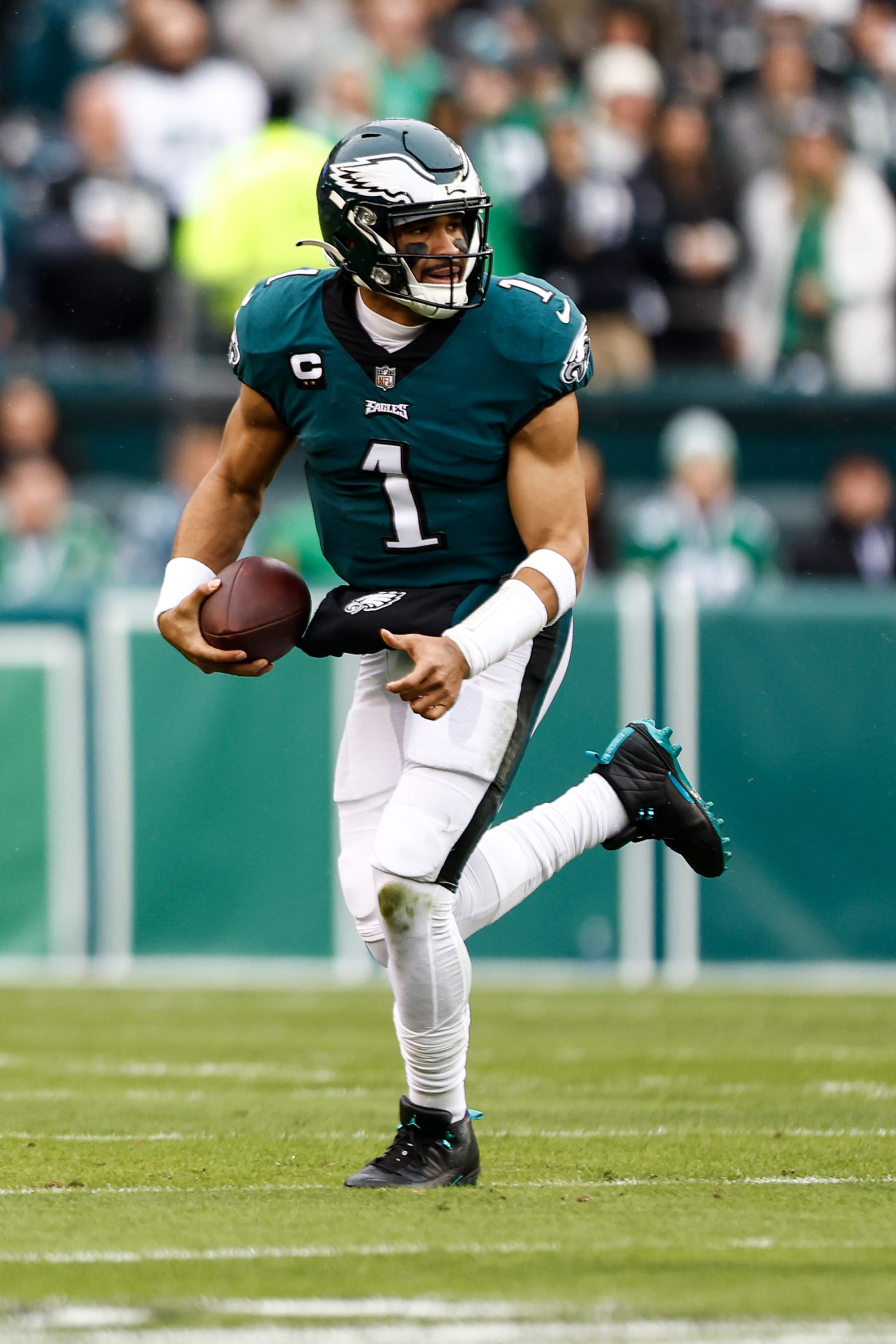 PHILADELPHIA, PA - JANUARY 29: Jalen Hurts #1 of the Philadelphia Eagles carries the ball during the first quarter of the NFC Championship NFL football game against the San Francisco 49ers at Lincoln Financial Field on January 29, 2023 in Philadelphia, Pennsylvania. (Photo by Kevin Sabitus/Getty Images)