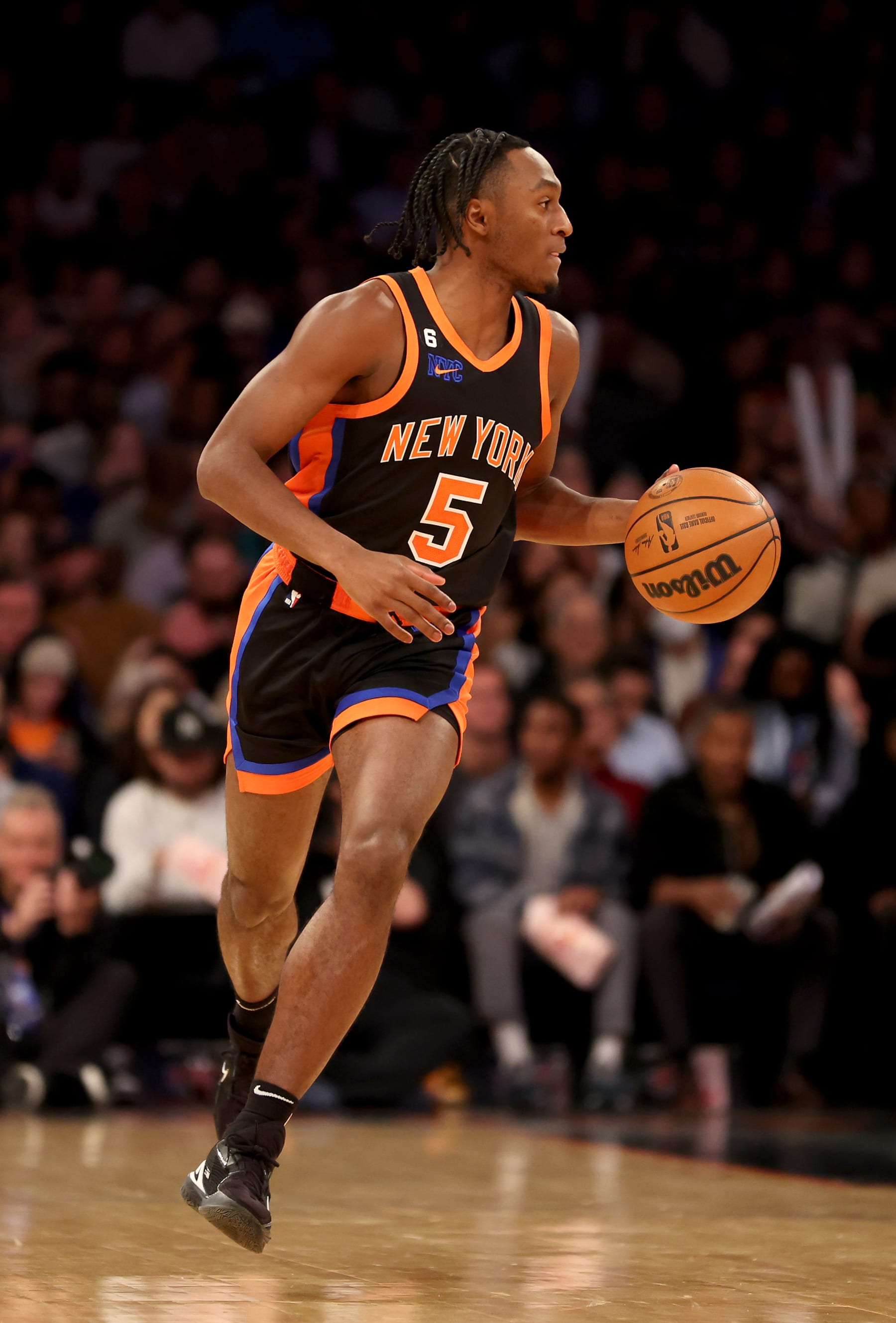 NEW YORK, NEW YORK - DECEMBER 20: Immanuel Quickley #5 of the New York Knicks dribbles the ball against the Golden State Warriors during the third quarter of the game at Madison Square Garden on December 20, 2022 in New York City. NOTE TO USER: User expressly acknowledges and agrees that, by downloading and/or using this photograph, User is consenting to the terms and conditions of the Getty Images License Agreement. (Photo by Sarah Stier/Getty Images)