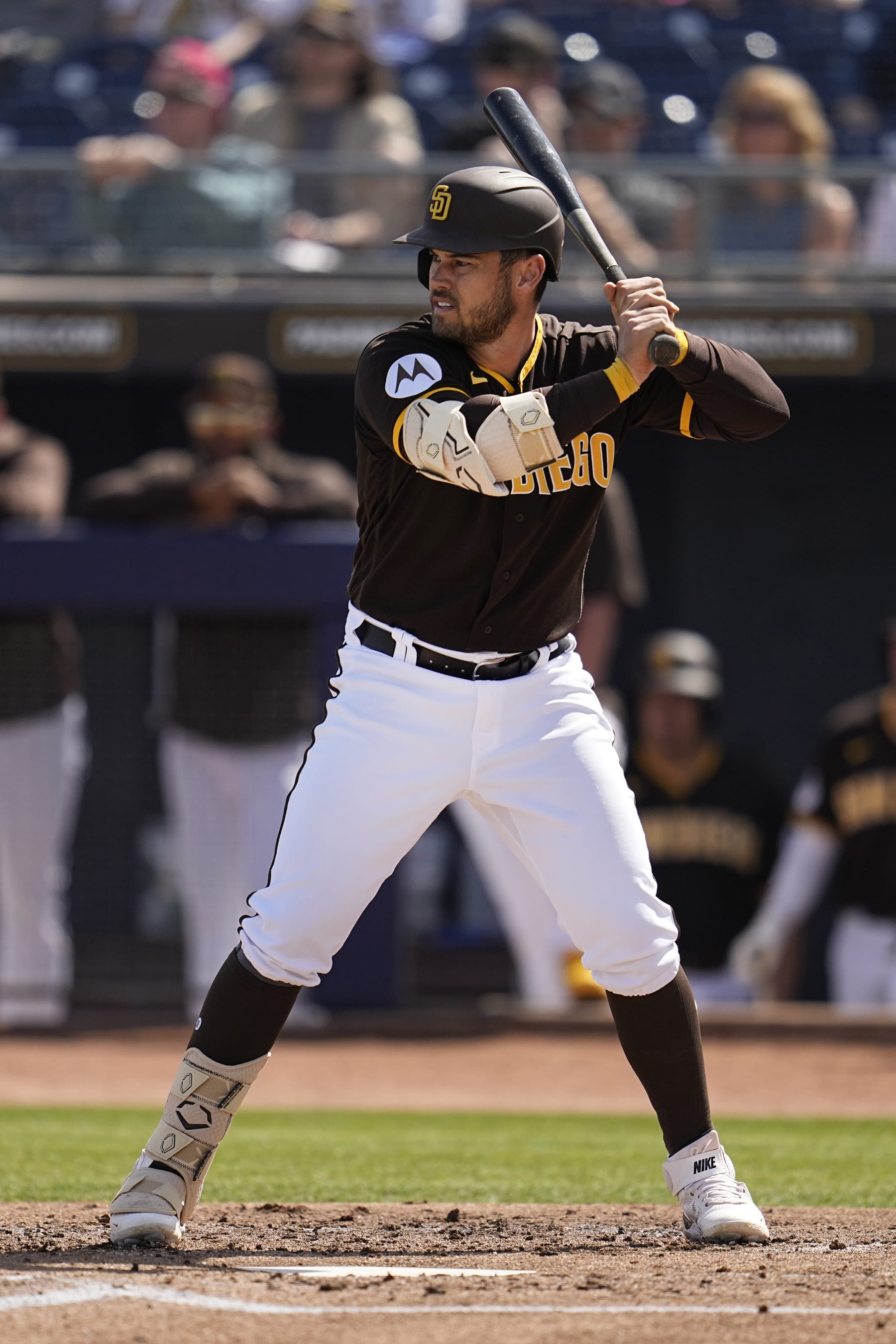 San Diego Padres' Preston Tucker bats during the second inning of a spring training baseball game against the Cincinnati Reds, Wednesday, March 8, 2023, in Peoria, Ariz. (AP Photo/Abbie Parr)