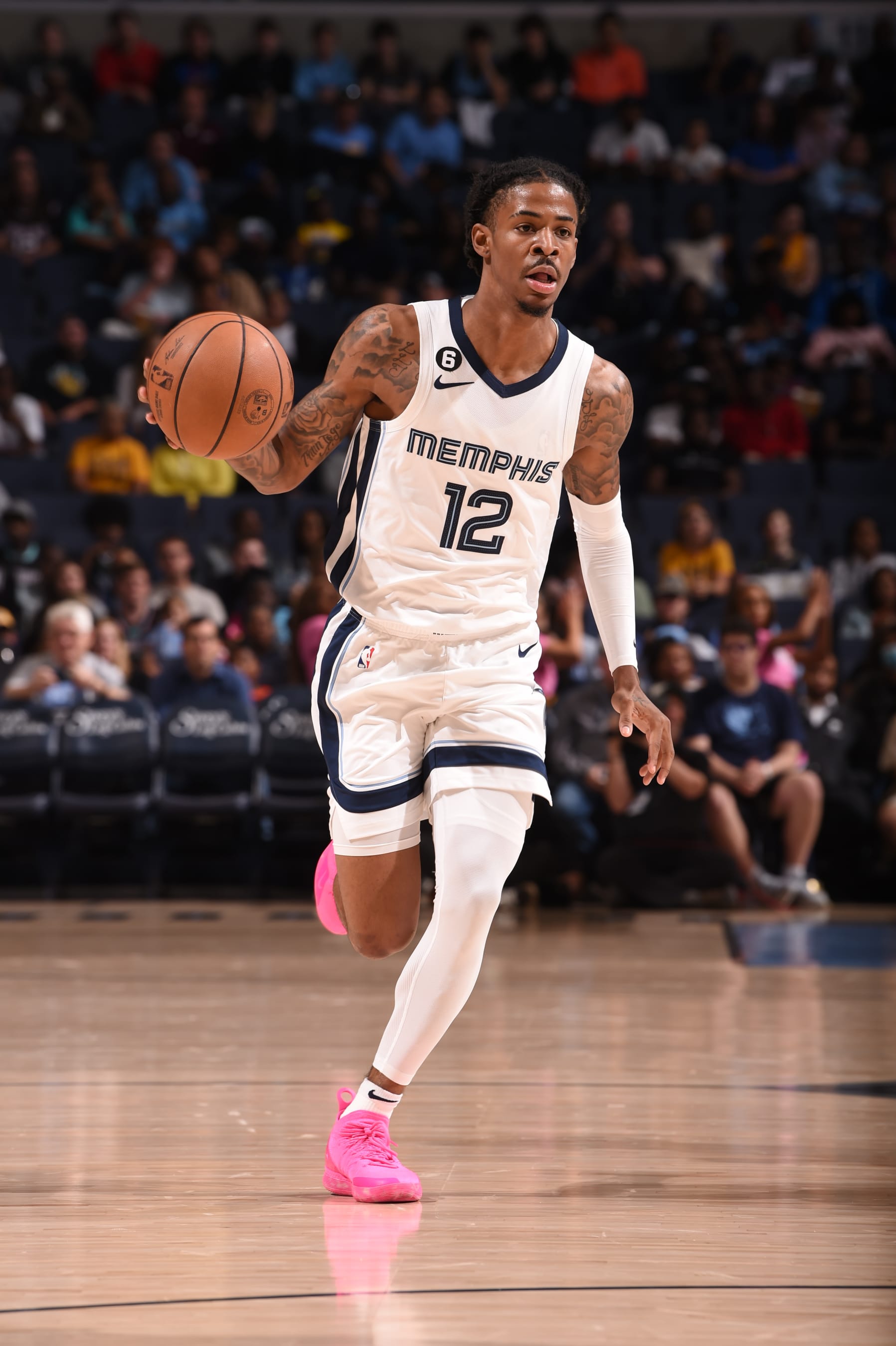 MEMPHIS, TN - OCTOBER 7: Ja Morant #12 of the Memphis Grizzlies dribbles the ball during a preseason game against the Miami Heat on October 7, 2022 at FedExForum in Memphis, Tennessee. NOTE TO USER: User expressly acknowledges and agrees that, by downloading and or using this Photograph, user is consenting to the terms and conditions of the Getty Images License Agreement. Mandatory Copyright Notice: Copyright 2022 NBAE (Photo by David Dow/NBAE via Getty Images)