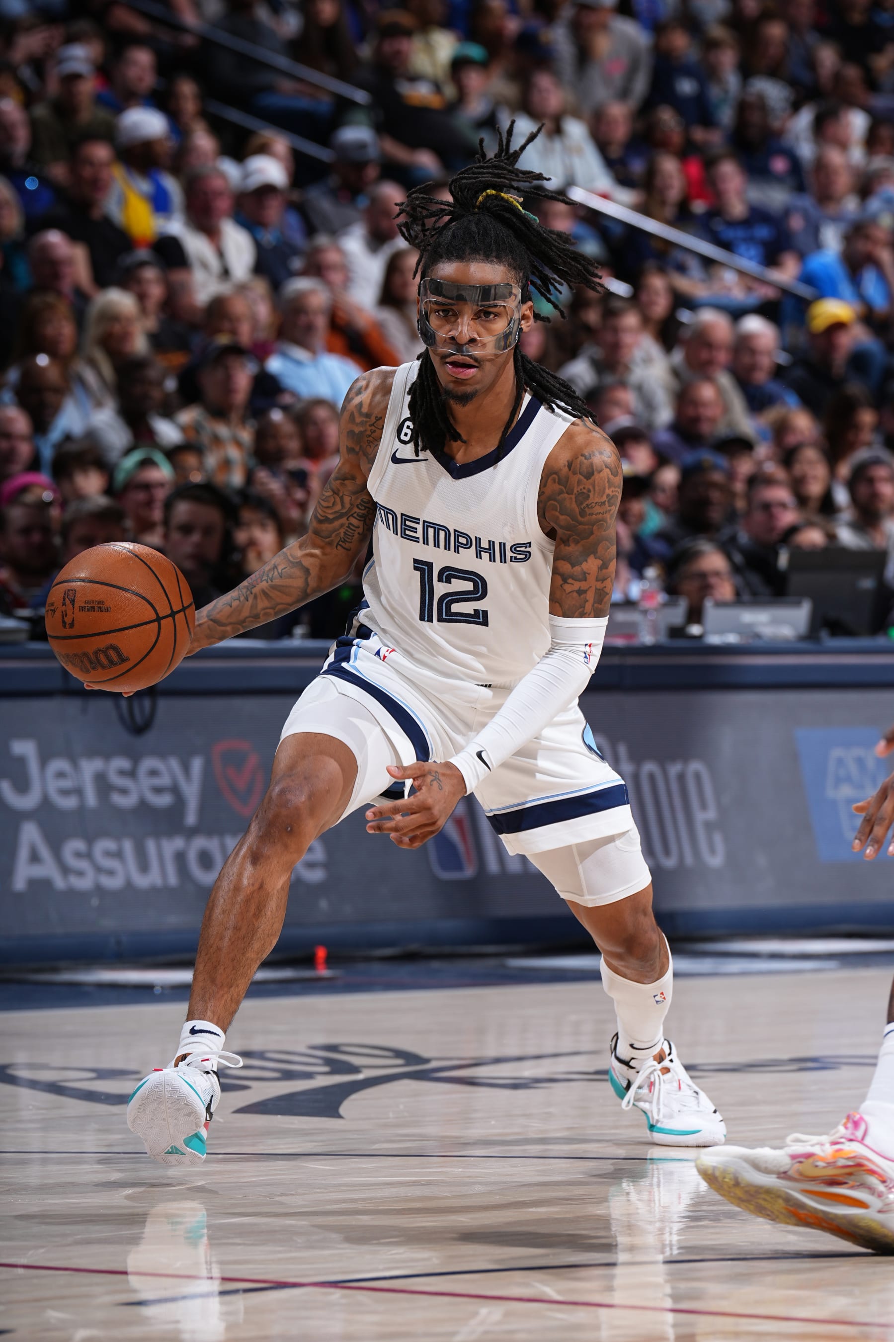 DENVER, CO - MARCH 3: Ja Morant #12 of the Memphis Grizzlies dribbles the ball during the game against the Denver Nuggets on March 3, 2023 at the Ball Arena in Denver, Colorado. NOTE TO USER: User expressly acknowledges and agrees that, by downloading and/or using this Photograph, user is consenting to the terms and conditions of the Getty Images License Agreement. Mandatory Copyright Notice: Copyright 2023 NBAE (Photo by Garrett Ellwood/NBAE via Getty Images)
