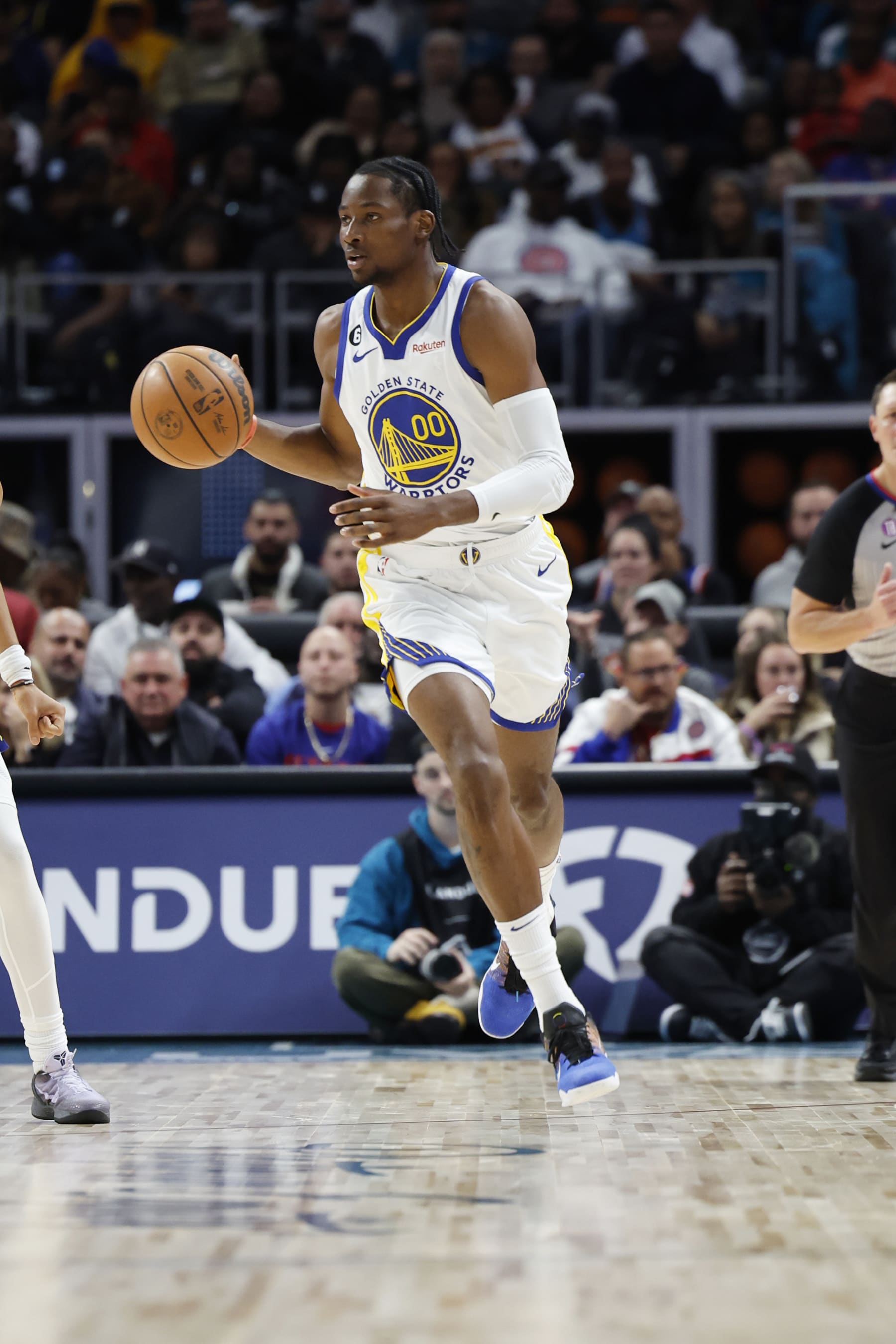 DETROIT, MICHIGAN - OCTOBER 30:  Jonathan Kuminga #00 of the Golden State Warriors dribbles against the Detroit Pistons at Little Caesars Arena on October 30, 2022 in Detroit, Michigan. NOTE TO USER: User expressly acknowledges and agrees that, by downloading and or using this photograph, User is consenting to the terms and conditions of the Getty Images License Agreement.  (Photo by Rick Osentoski/Getty Images)