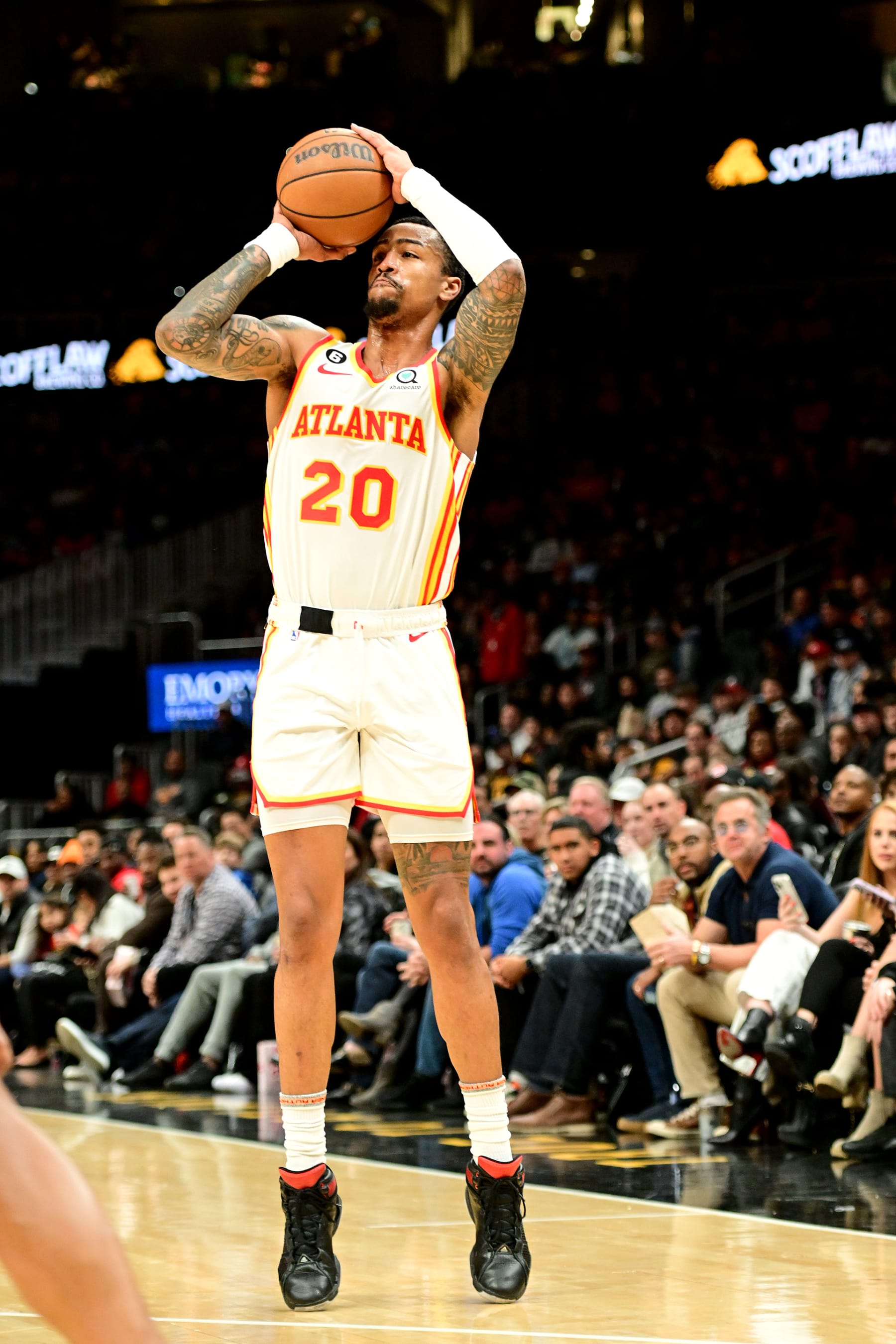 ATLANTA, GA - NOVEMBER 19: John Collins #20 of the Atlanta Hawks shoots a three point basket during the game against the Toronto Raptors on November 19, 2022 at State Farm Arena in Atlanta, Georgia.  NOTE TO USER: User expressly acknowledges and agrees that, by downloading and/or using this Photograph, user is consenting to the terms and conditions of the Getty Images License Agreement. Mandatory Copyright Notice: Copyright 2022 NBAE (Photo by Adam Hagy/NBAE via Getty Images)