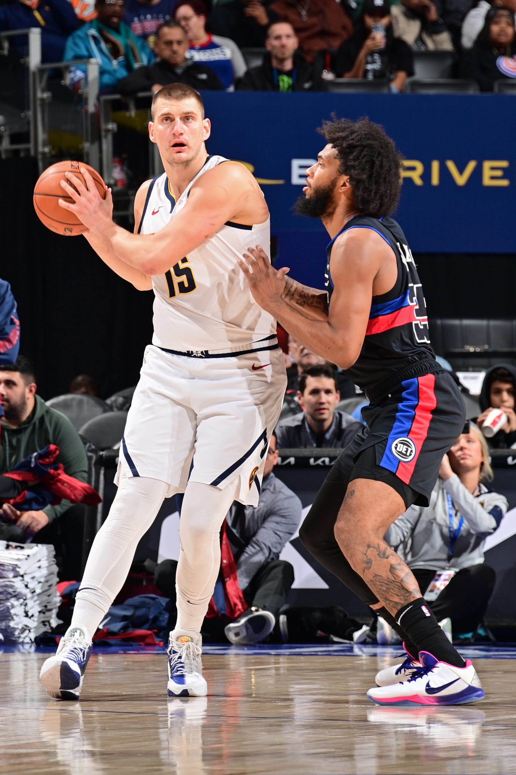 DETROIT, MI - NOVEMBER 20: Nikola Jokic #15 of the Denver Nuggets handles the ball during the game  on November 20, 2023 at Little Caesars Arena in Detroit, Michigan. NOTE TO USER: User expressly acknowledges and agrees that, by downloading and/or using this photograph, User is consenting to the terms and conditions of the Getty Images License Agreement. Mandatory Copyright Notice: Copyright 2023 NBAE (Photo by Chris Schwegler/NBAE via Getty Images)