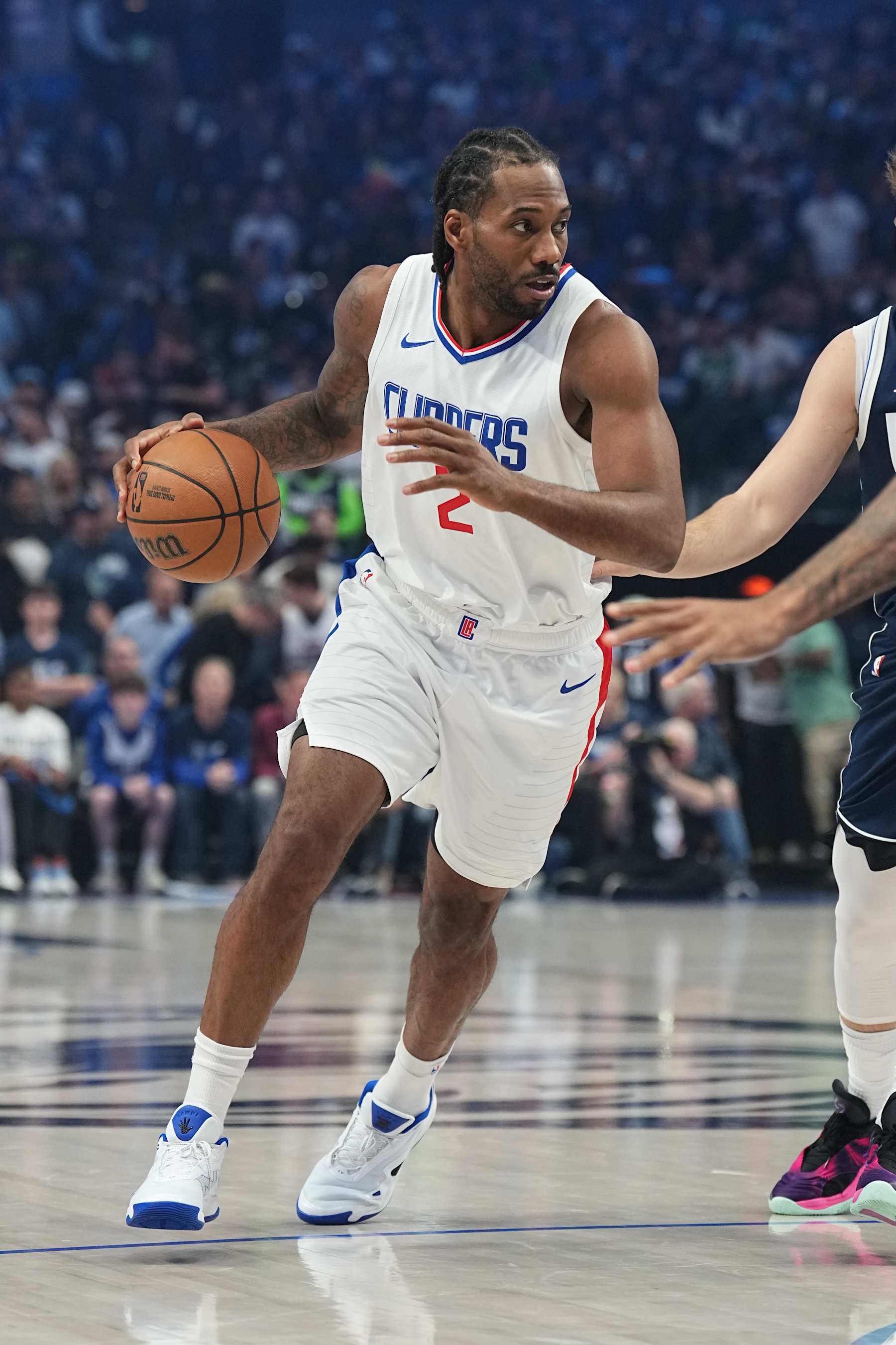 DALLAS, TX - APRIL 26: Kawhi Leonard #2 of the LA Clippers dribbles the ball during the game against the Dallas Mavericks during Round 1 Game 3 of the 2024 NBA Playoffs on April 26, 2024 at the American Airlines Center in Dallas, Texas. NOTE TO USER: User expressly acknowledges and agrees that, by downloading and or using this photograph, User is consenting to the terms and conditions of the Getty Images License Agreement. Mandatory Copyright Notice: Copyright 2023 NBAE (Photo by Glenn James/NBAE via Getty Images)