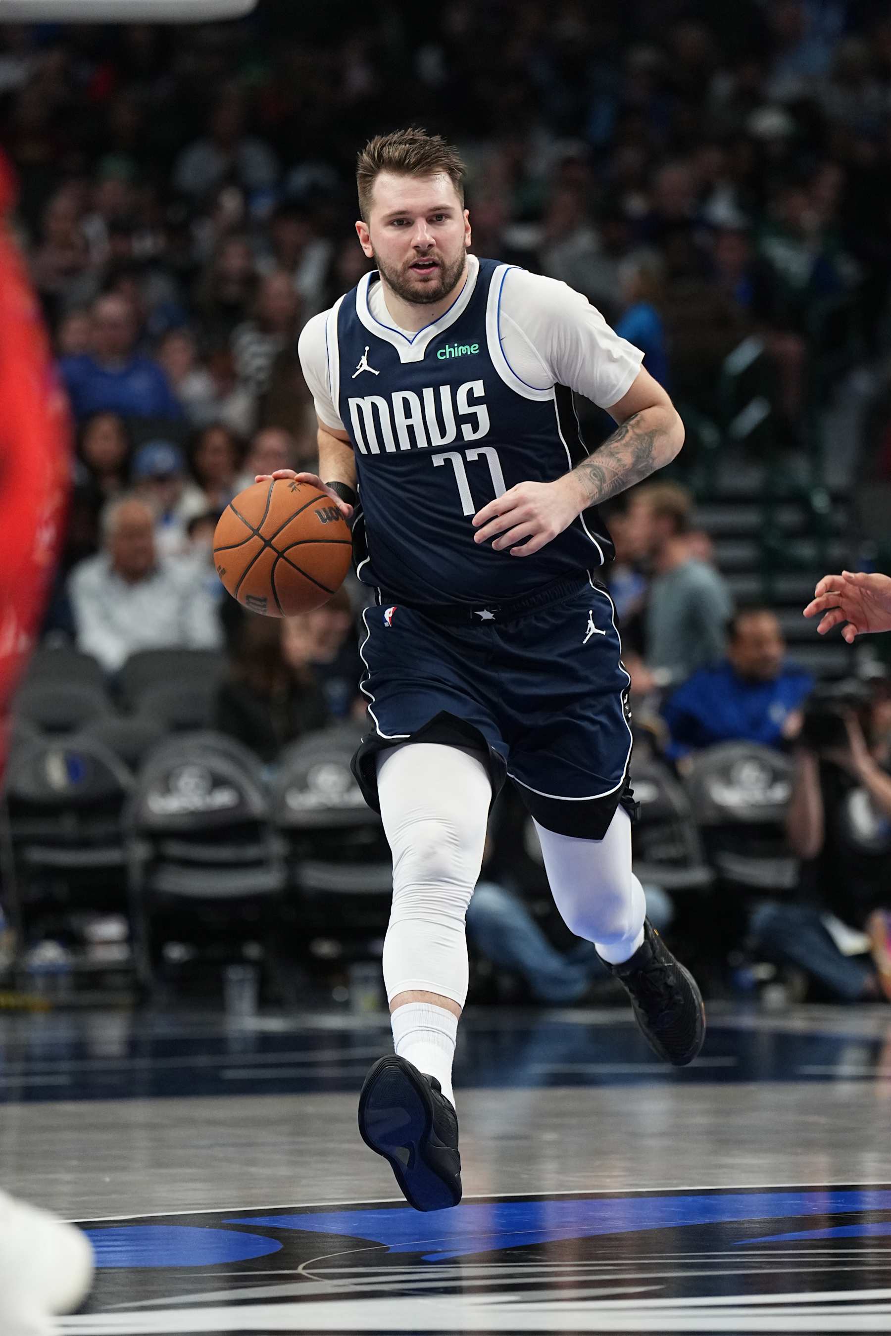 DALLAS, TX - DECEMBER 23: Luka Doncic #77 of the Dallas Mavericks dribbles the ball during the game against the Portland Trail Blazers on December 23, 2024 at American Airlines Center in Dallas, Texas. NOTE TO USER: User expressly acknowledges and agrees that, by downloading and or using this photograph, User is consenting to the terms and conditions of the Getty Images License Agreement. Mandatory Copyright Notice: Copyright 2024 NBAE (Photo by Glenn James/NBAE via Getty Images)