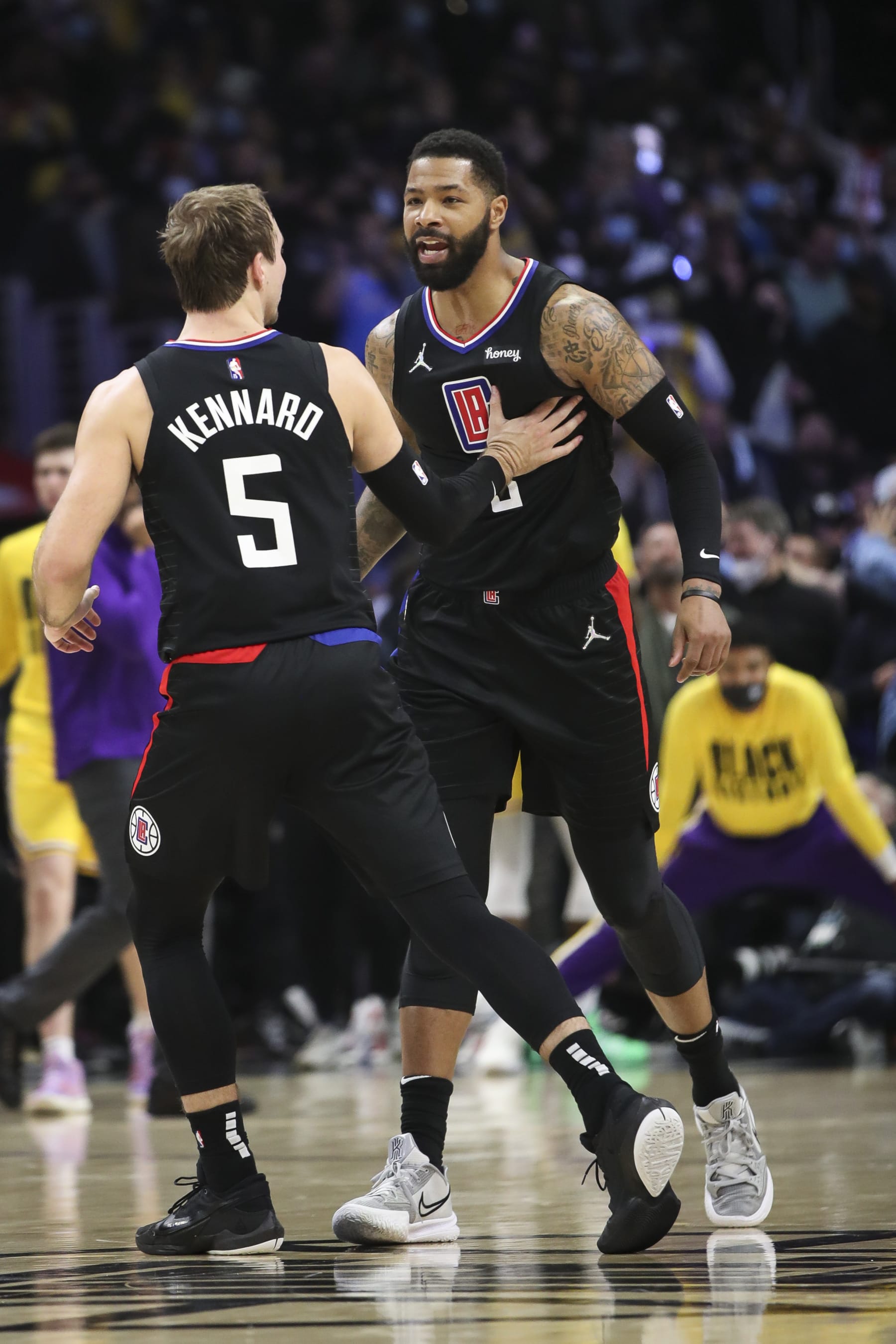 LOS ANGELES, CALIFORNIA - FEBRUARY 03: Luke Kennard #5 celebrates with Marcus Morris Sr. #8 of the Los Angeles Clippers after scoring against the Los Angeles Lakers at Crypto.com Arena on February 03, 2022 in Los Angeles, California. NOTE TO USER: User expressly acknowledges and agrees that, by downloading and or using this photograph, User is consenting to the terms and conditions of the Getty Images License Agreement. (Photo by Meg Oliphant/Getty Images)