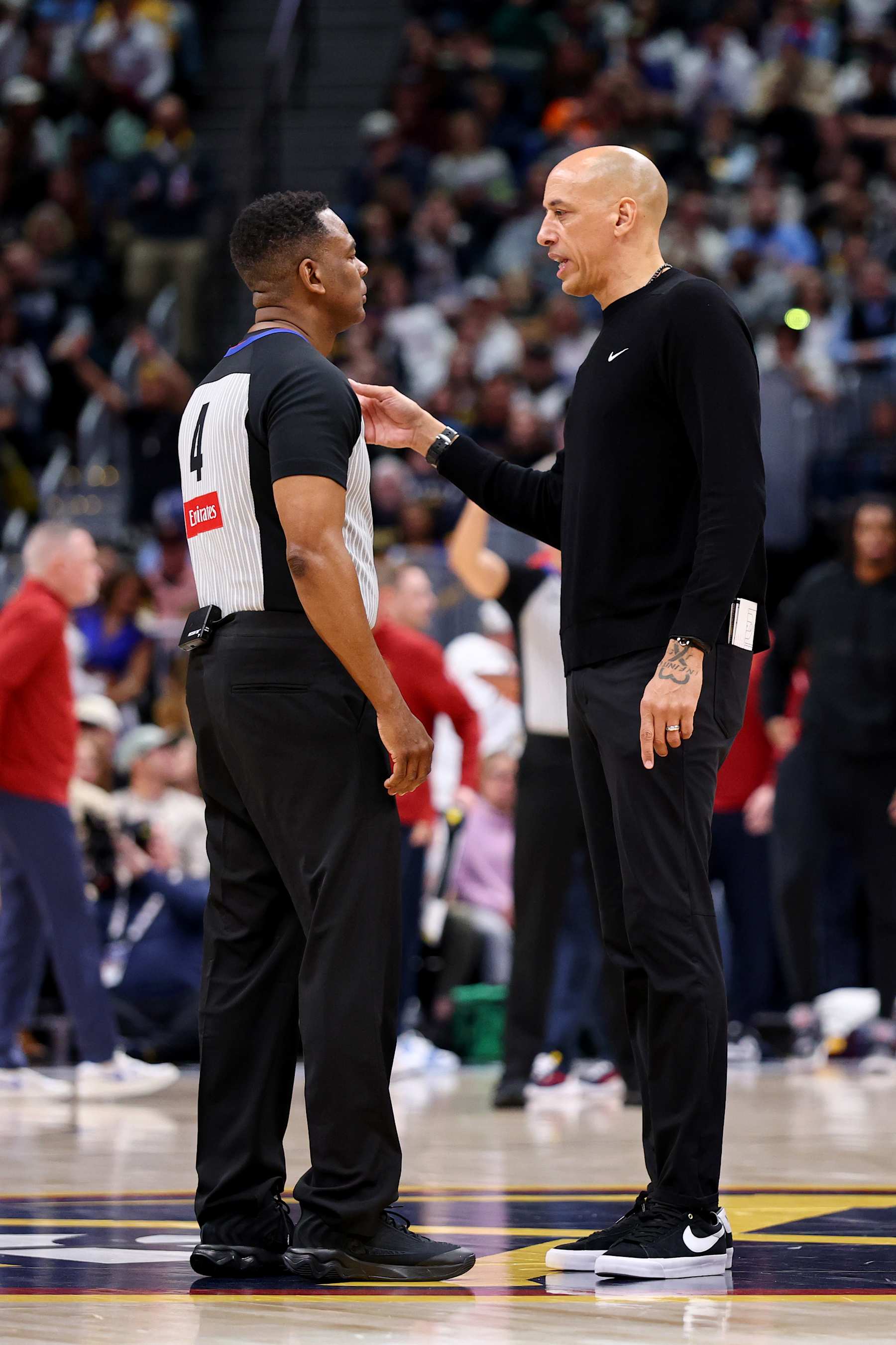 DENVER, COLORADO - JANUARY 23: Head Coach Doug Christie of the Sacramento Kings talks with a referee against the Denver Nuggets at Ball Arena on January 23, 2025 in Denver, Colorado. NOTE TO USER: User expressly acknowledges and agrees that, by downloading and or using this photograph, User is consenting to the terms and conditions of the Getty Images License Agreement. (Photo by Jamie Schwaberow/Getty Images)