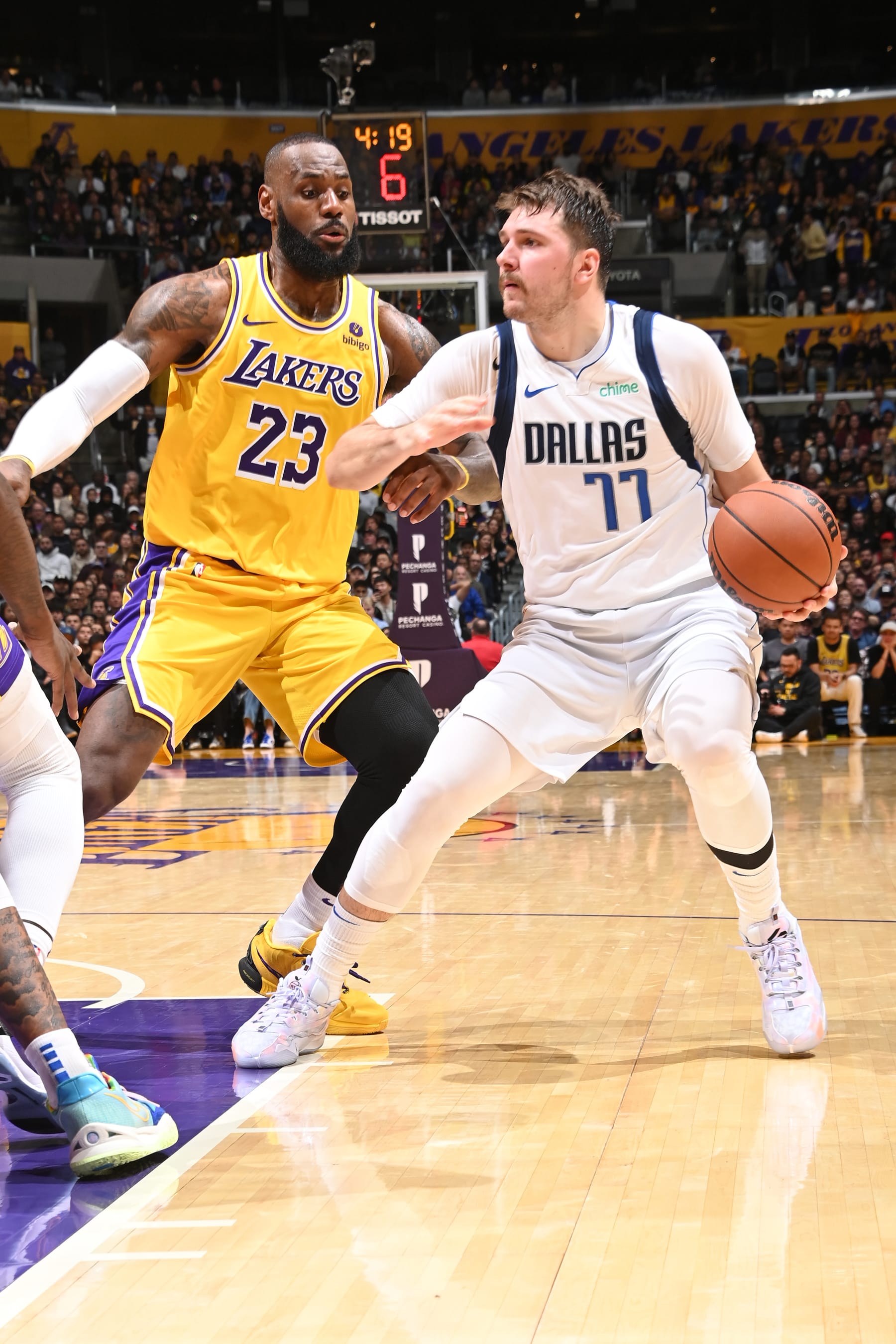 LOS ANGELES, CA - NOVEMBER 22:  Luka Doncic #77 of the Dallas Mavericks handles the ball during the game against LeBron James #23 of the Los Angeles Lakers on November 22, 2023 at Crypto.Com Arena in Los Angeles, California. NOTE TO USER: User expressly acknowledges and agrees that, by downloading and/or using this Photograph, user is consenting to the terms and conditions of the Getty Images License Agreement. Mandatory Copyright Notice: Copyright 2023 NBAE (Photo by Andrew D. Bernstein/NBAE via Getty Images)