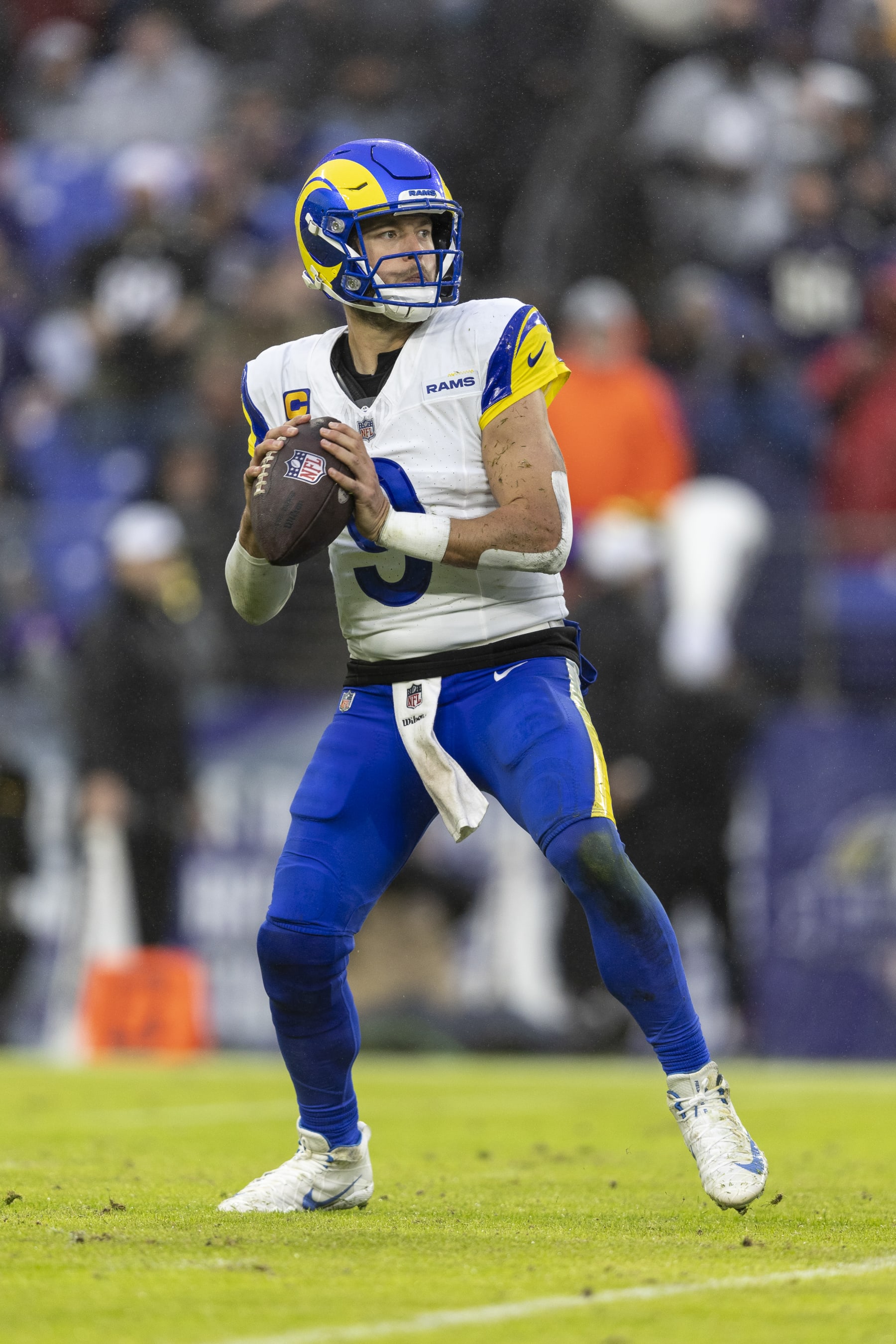 BALTIMORE, MARYLAND - DECEMBER 10: Matthew Stafford #9 of the Los Angeles Rams drops back and looks to pass during an NFL football game between the Baltimore Ravens and the Los Angeles Rams at M&T Bank Stadium on December 10, 2023 in Baltimore, Maryland. (Photo by Michael Owens/Getty Images)