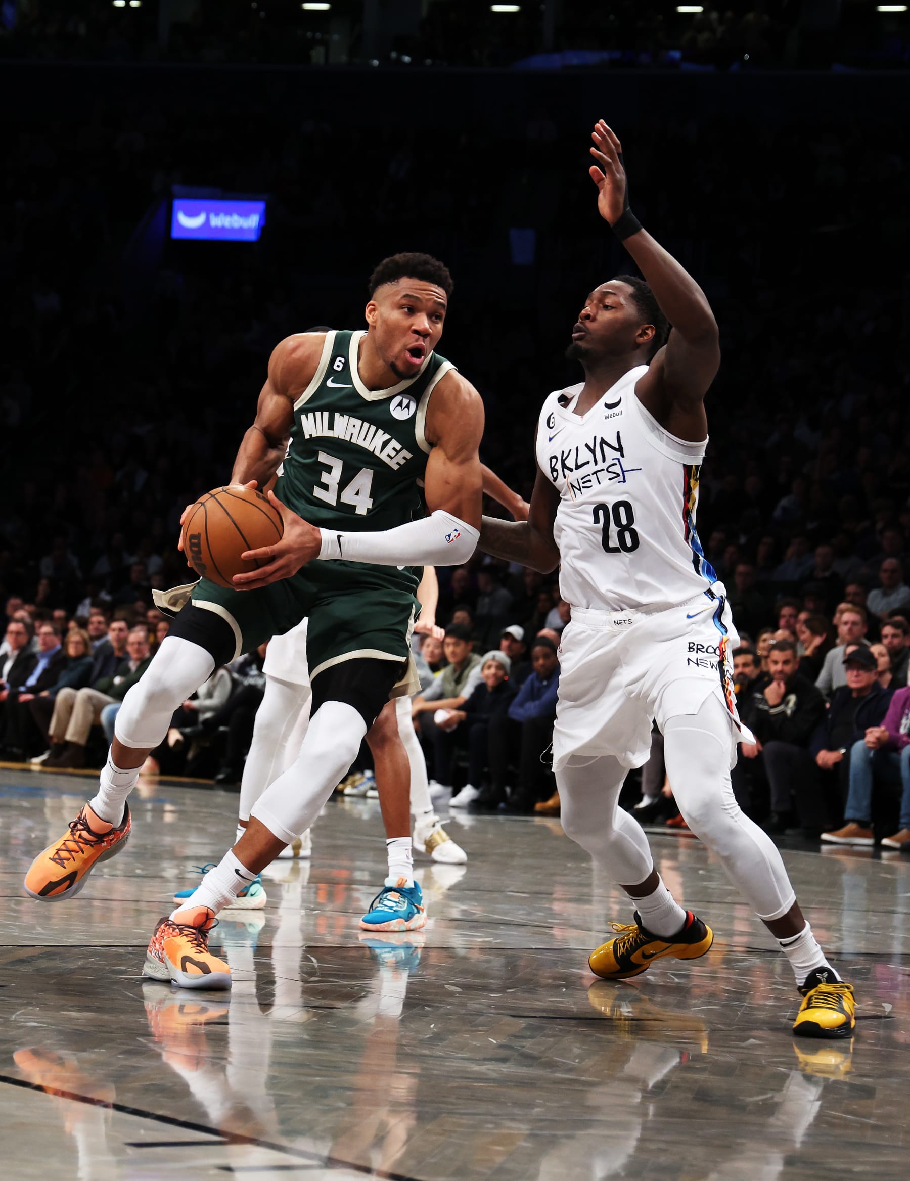 NEW YORK, NEW YORK - FEBRUARY 28:  Giannis Antetokounmpo #34 of the Milwaukee Bucks drives against Dorian Finney-Smith #28 of the Brooklyn Nets during their game at Barclays Center on February 28, 2023 in New York City.  User expressly acknowledges and agrees that, by downloading and or using this photograph, User is consenting to the terms and conditions of the Getty Images License Agreement.   (Photo by Al Bello/Getty Images)