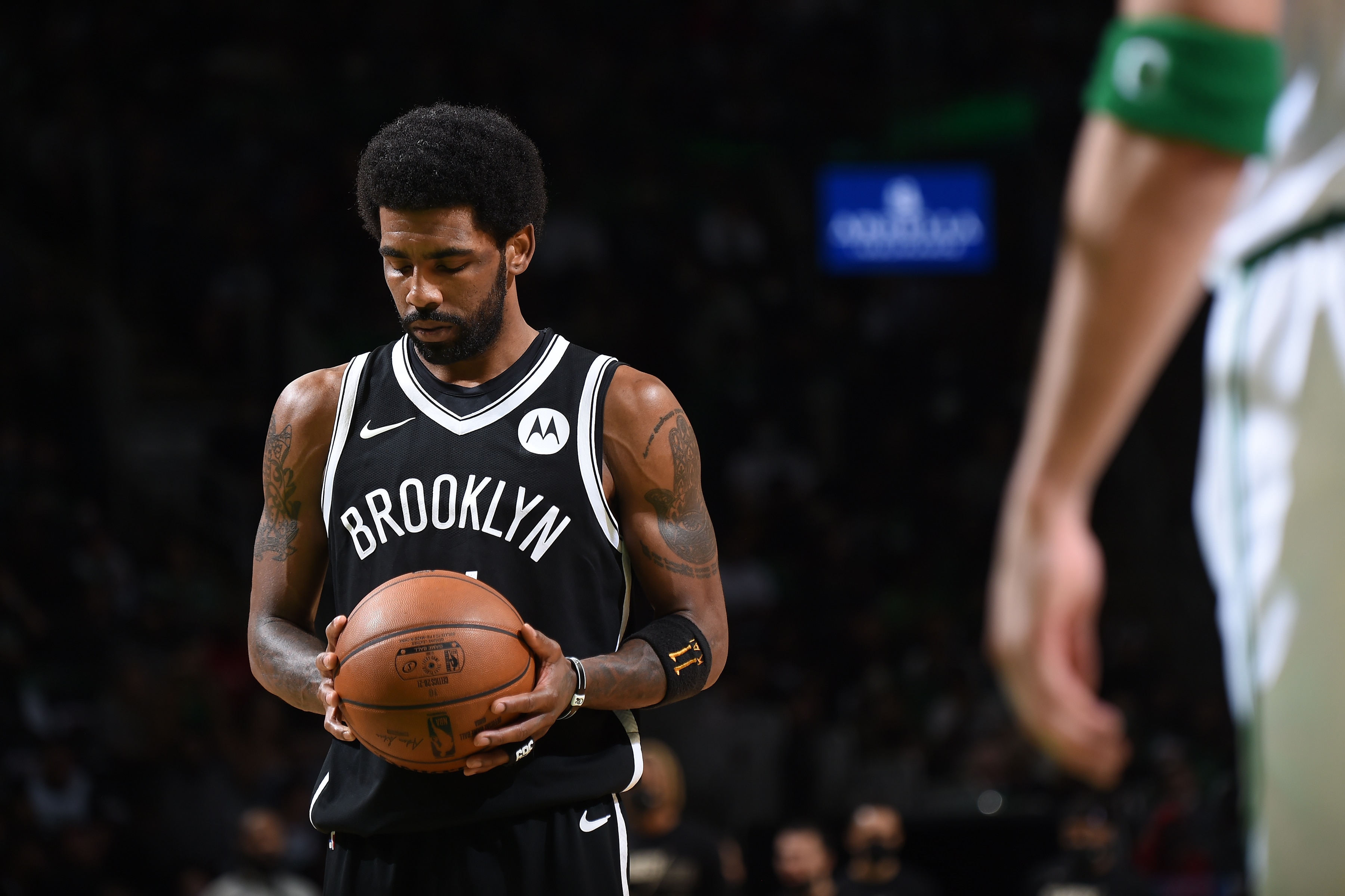 BOSTON, MA - MAY 30: Kyrie Irving #11 of the Brooklyn Nets looks on against the Boston Celtics during Round 1, Game 4 of the 2021 NBA Playoffs on May 30, 2021 at the TD Garden in Boston, Massachusetts.  NOTE TO USER: User expressly acknowledges and agrees that, by downloading and or using this photograph, User is consenting to the terms and conditions of the Getty Images License Agreement. Mandatory Copyright Notice: Copyright 2021 NBAE  (Photo by Brian Babineau/NBAE via Getty Images)